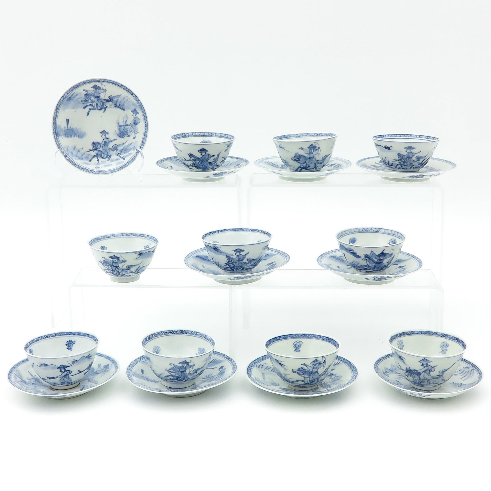 A Collection of Cups and Saucers: 10 cups and saucers, in blue and white decors, largest saucer is 13 cm. in diameter, in diverse conditions.