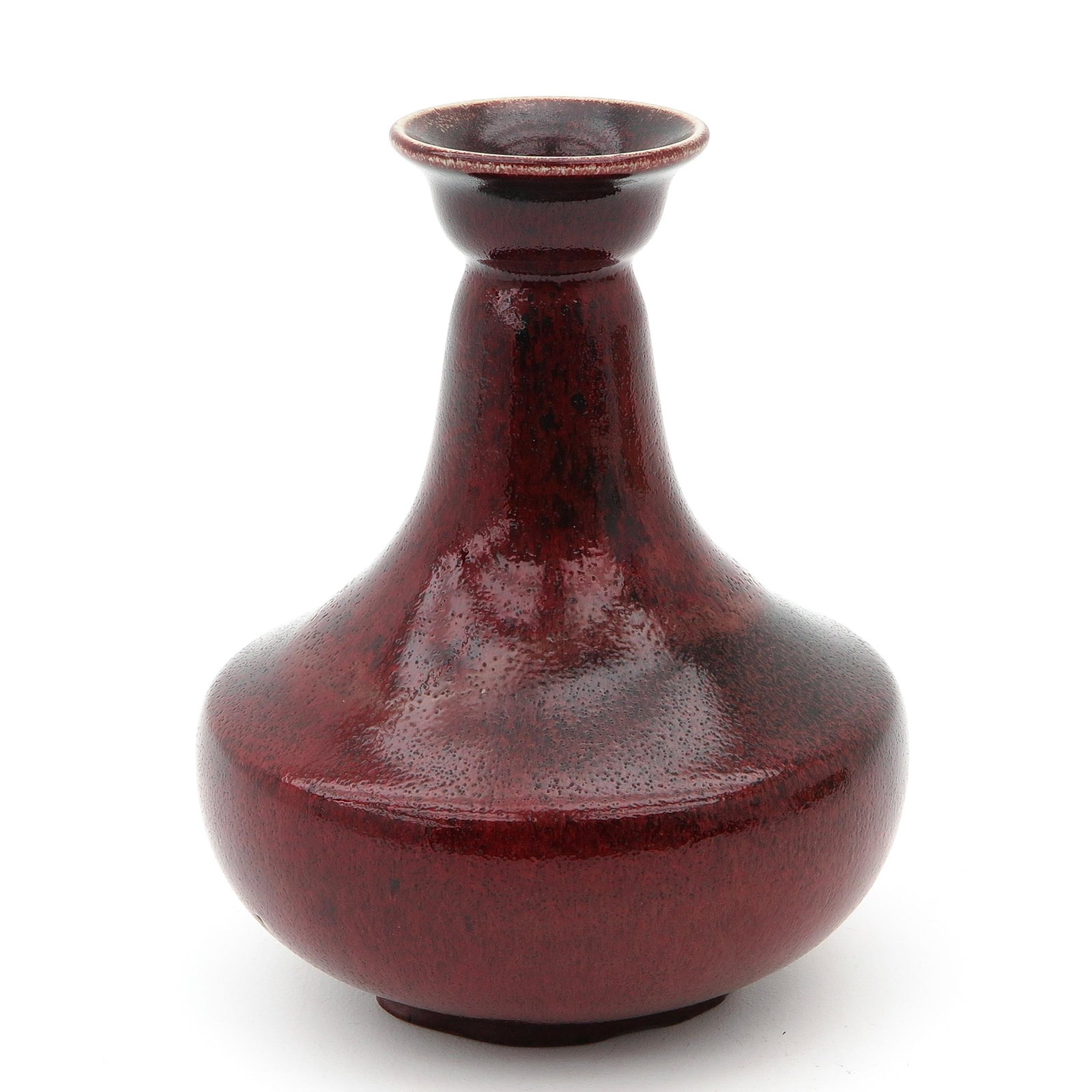 A Sang de Boeuf Vase: 21 cm. tall.