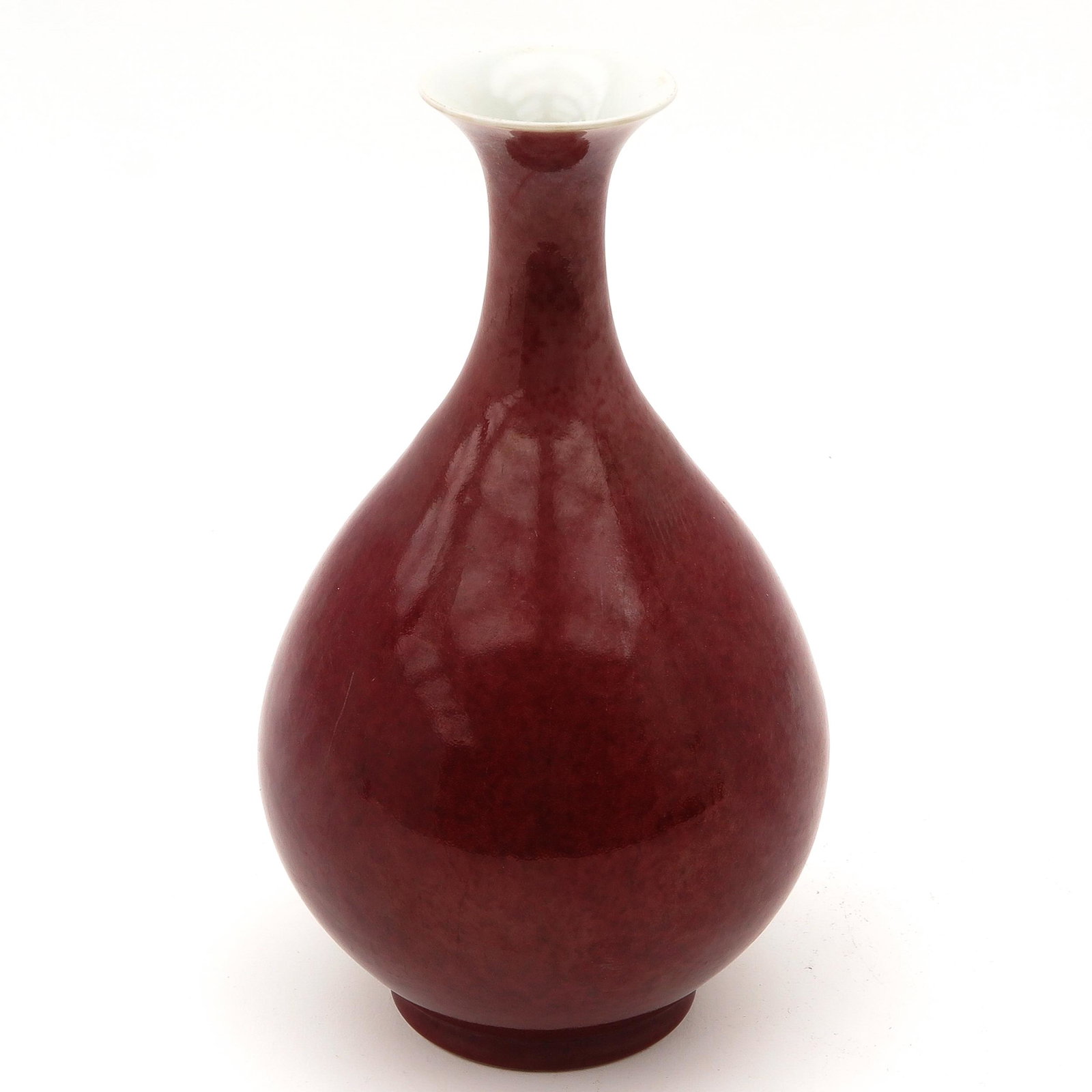 A Sang de Boeuf Vase: 33 cm. tall, signed with Chinese poem on bottom of vase, hairline in glaze.