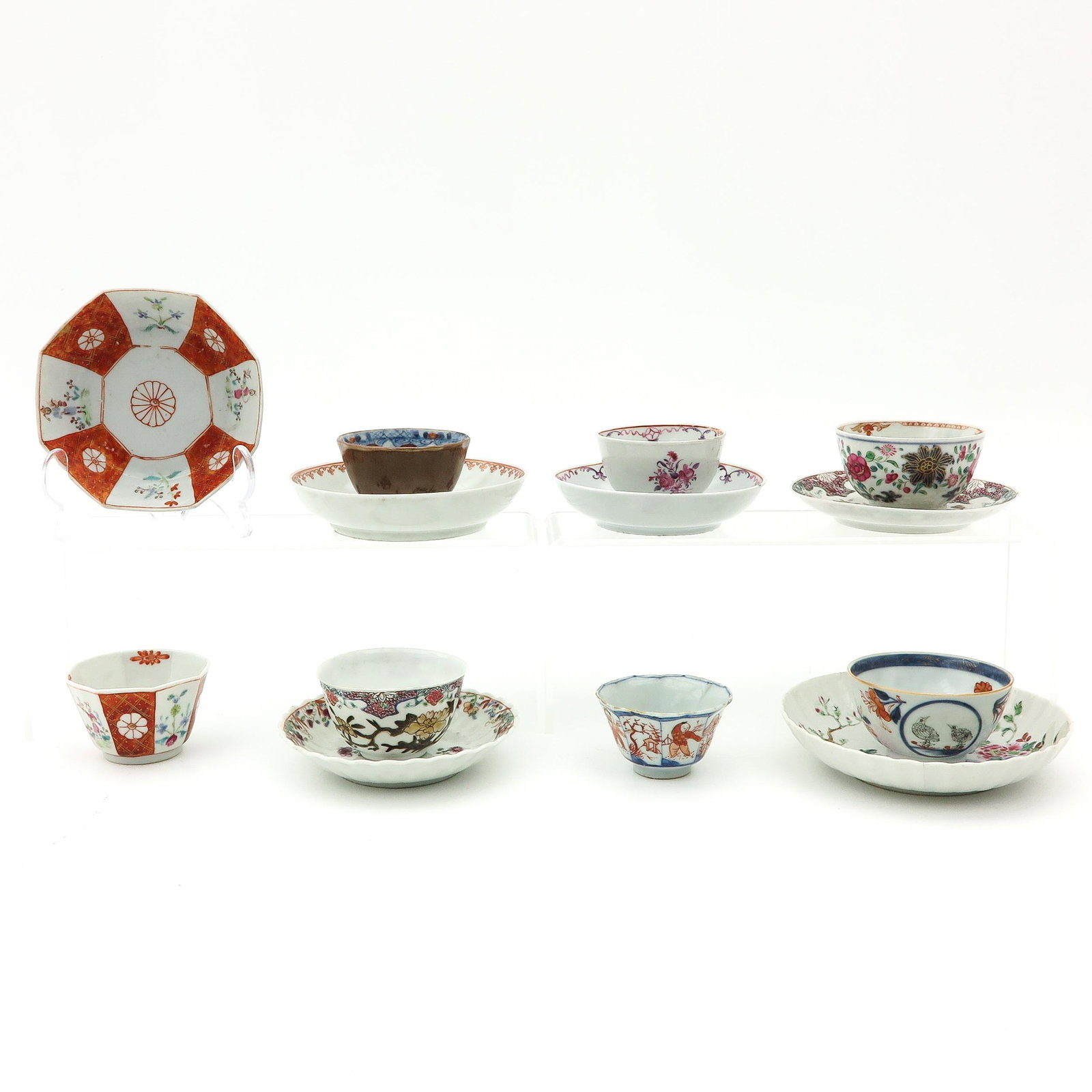 A Diverse Collection of Cups and Saucers: In diverse decors and sizes, largest saucer is 13 cm. in diameter, chip and hairline.