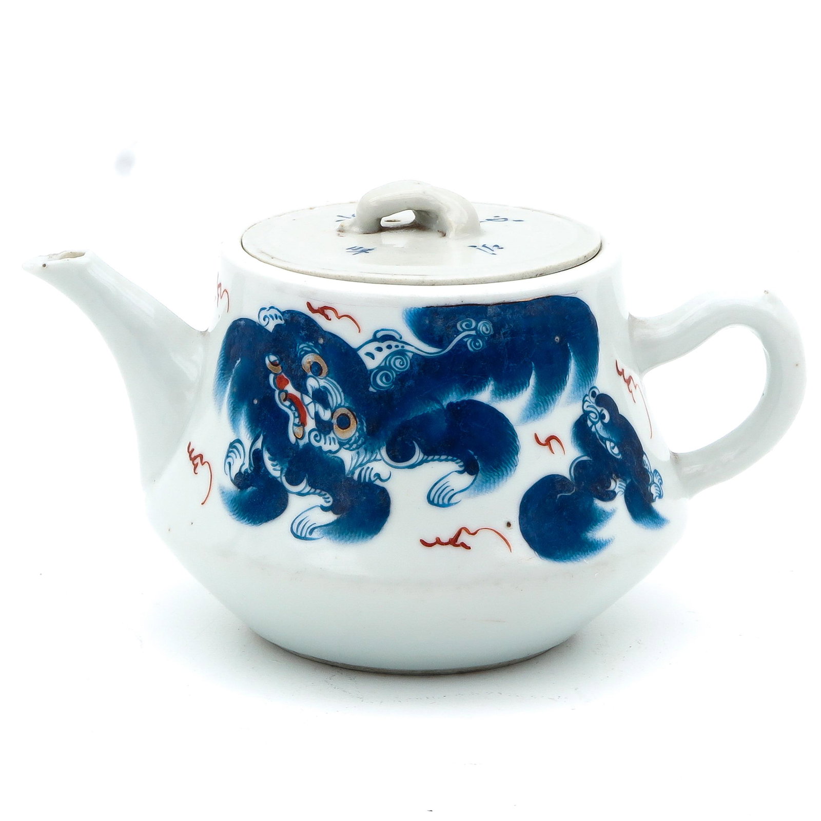 A Temple Lion Decor Teapot: Decorated with blue and red, 11 cm. tall, chip.