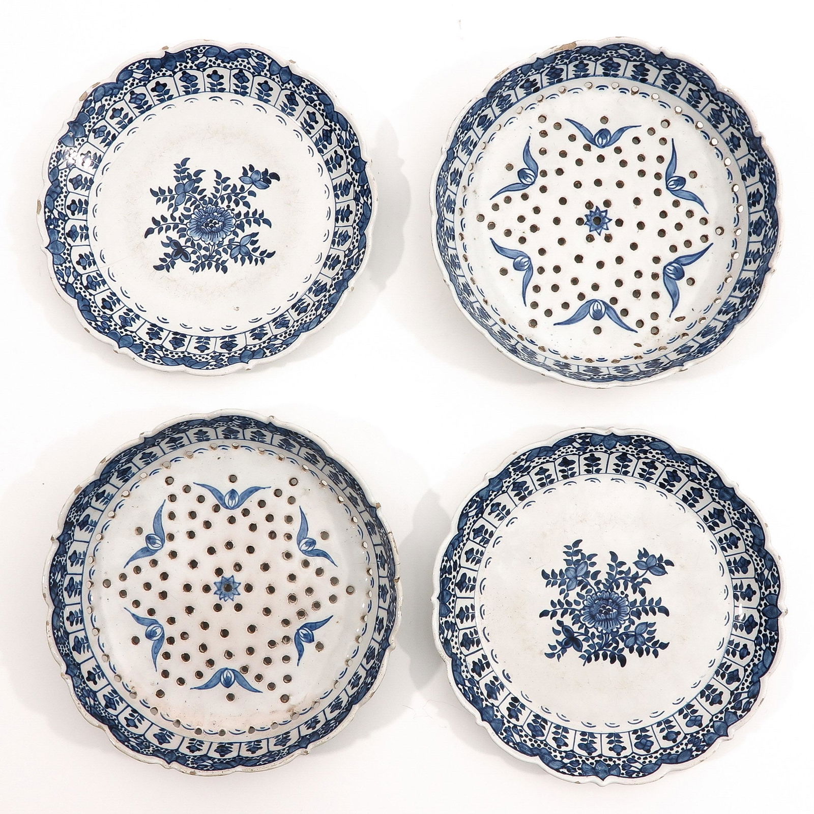A Diverse Collection: Consisting of 2 plates and 2 trivets, diameter 23 cm, various conditions