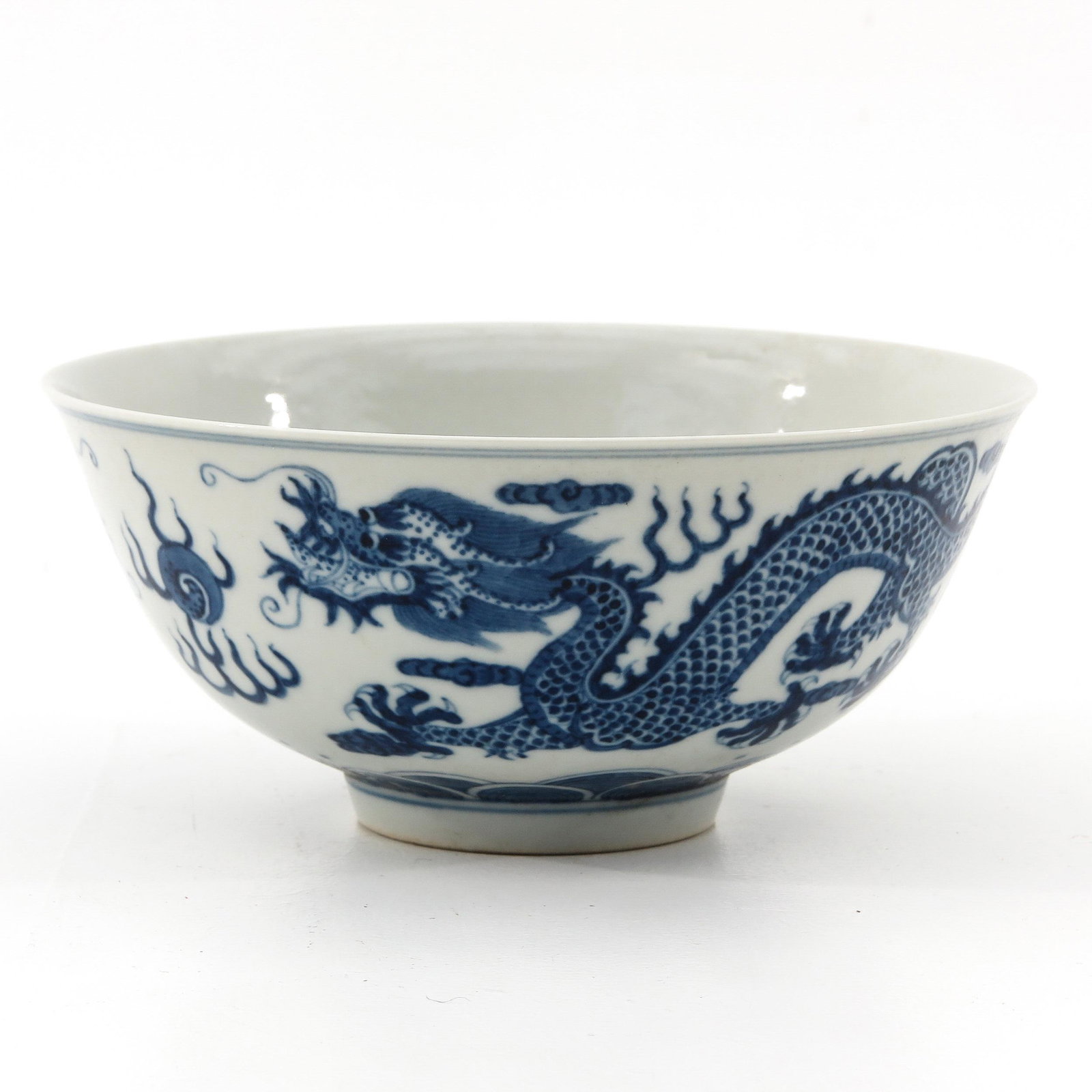 A Blue and White Bowl: Depicting 5 clawed dragon and clouds, Guangxu mark, 16 cm. in diameter.
