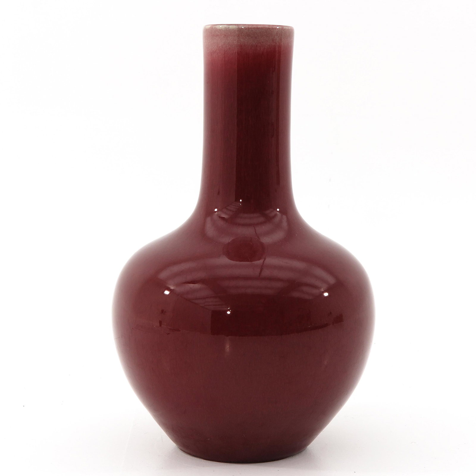 A Sang de Boeuf Bottle Vase: 24 cm. tall.