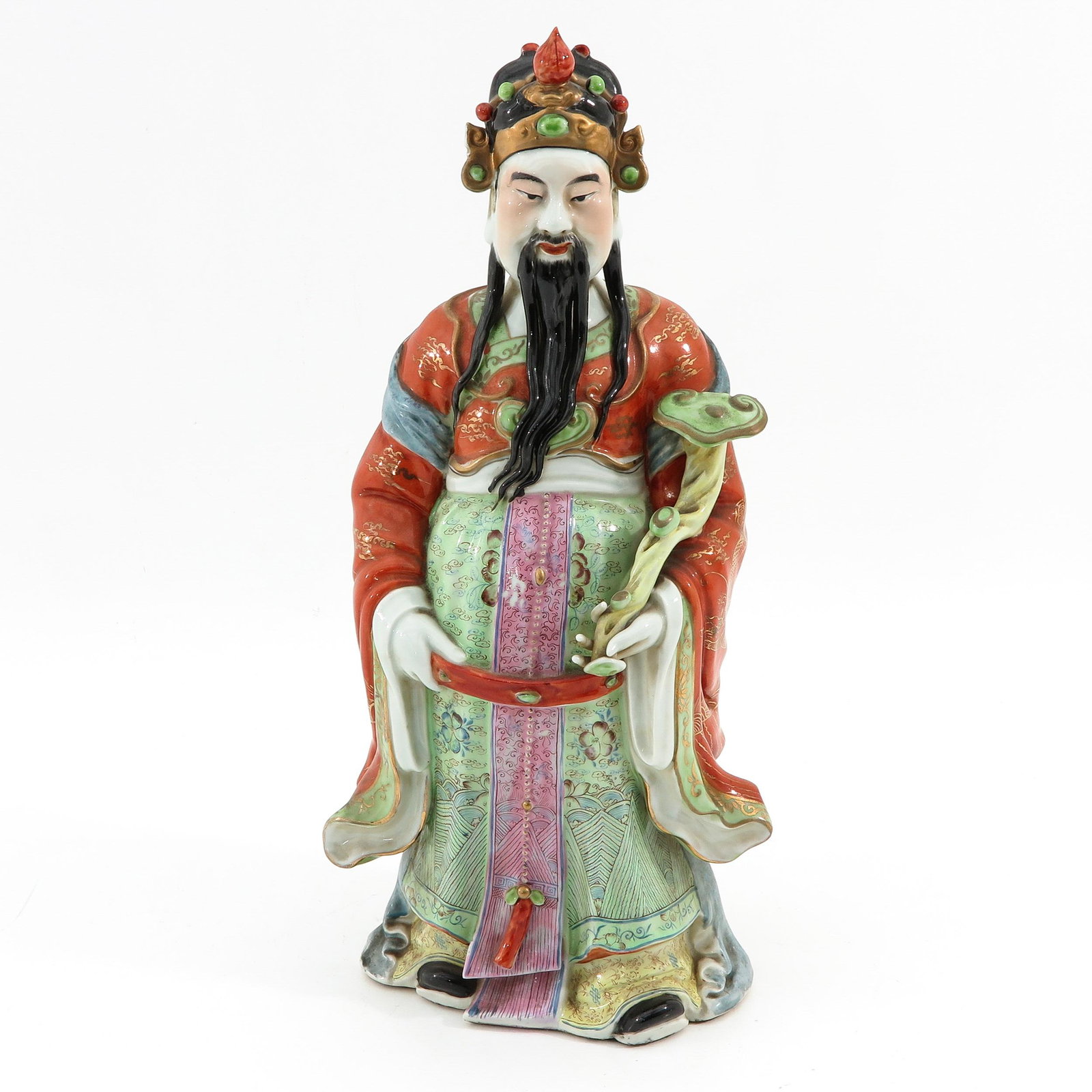 A Famille Rose Sculpture: Depicting Chinese immortal holding scepter, 47 cm. tall.