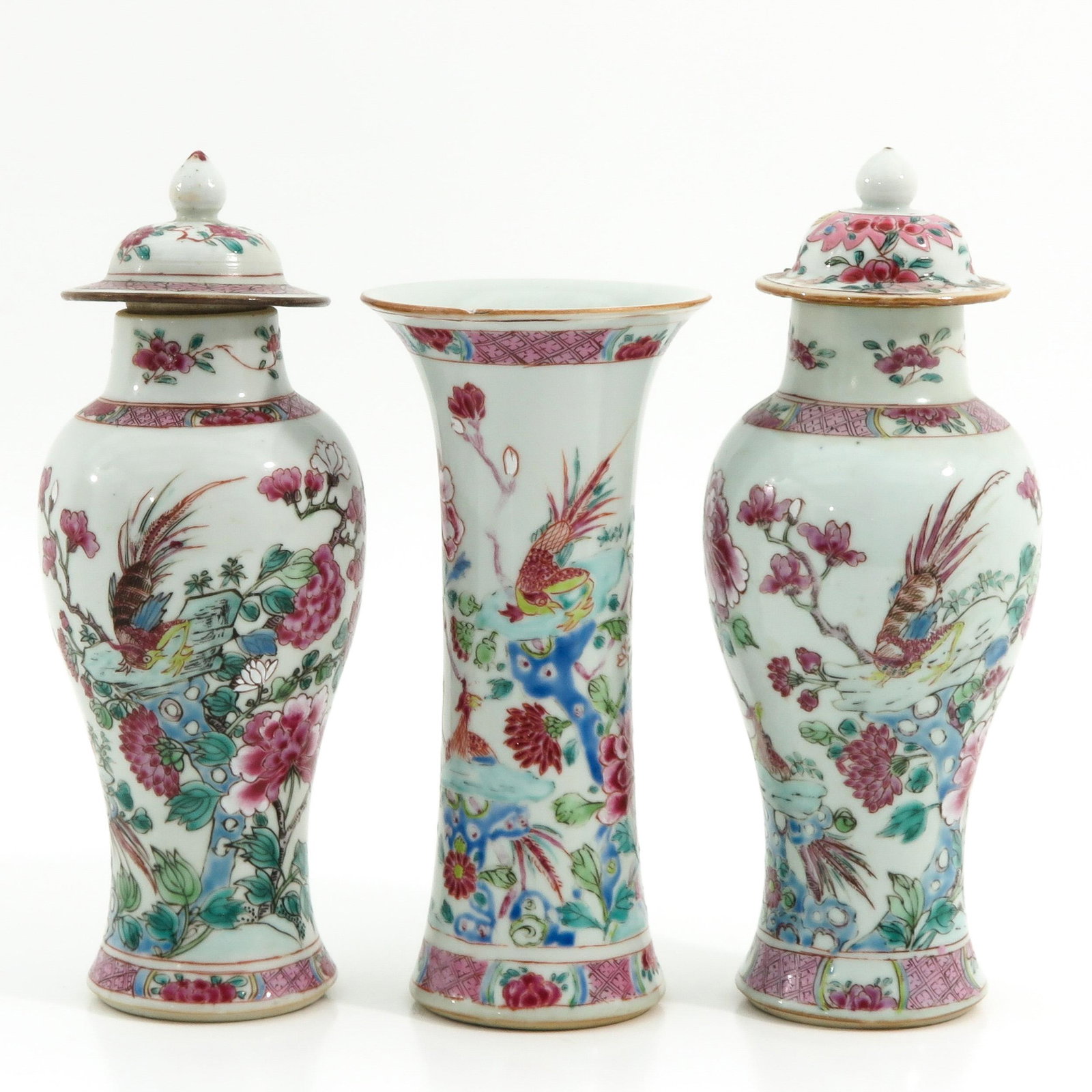 A Set of 3 Famille Rose Garniture Vases: Floral decor with birds, 23 cm. tall, with restoration.
