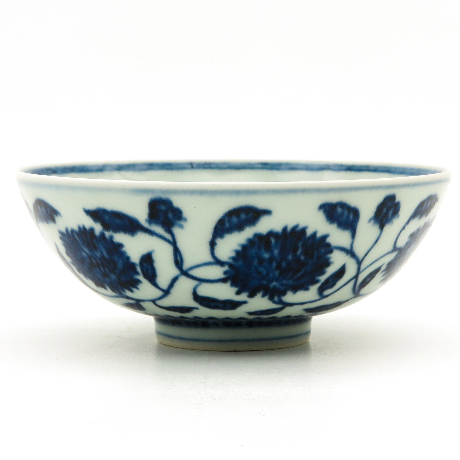 A Blue and White Bowl: Decorated with flowers, Xuantong mark, 17 cm. in diameter.