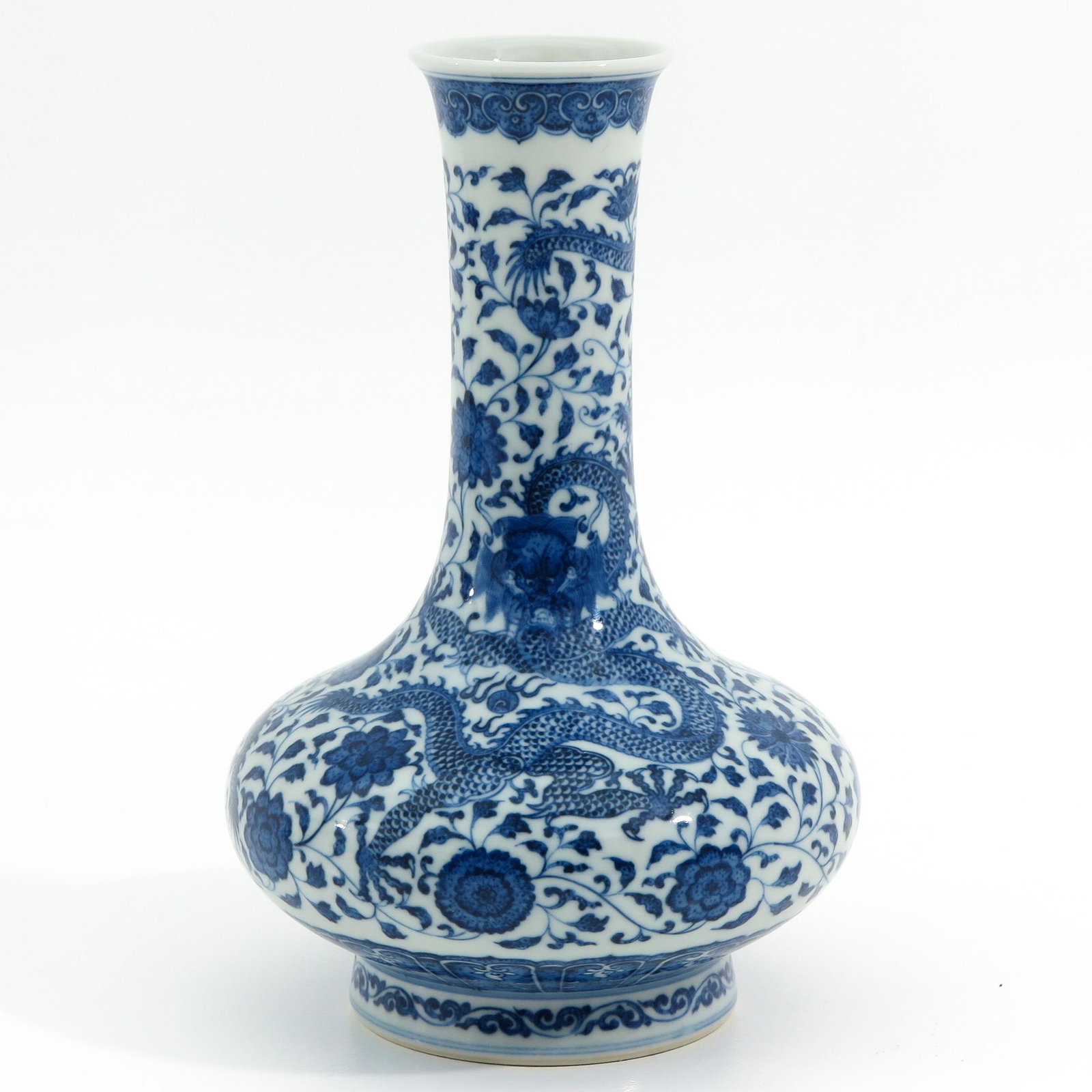 A Blue and White Vase: Decorated with dragons and flowers, 21 cm. tall, Qianlong mark.