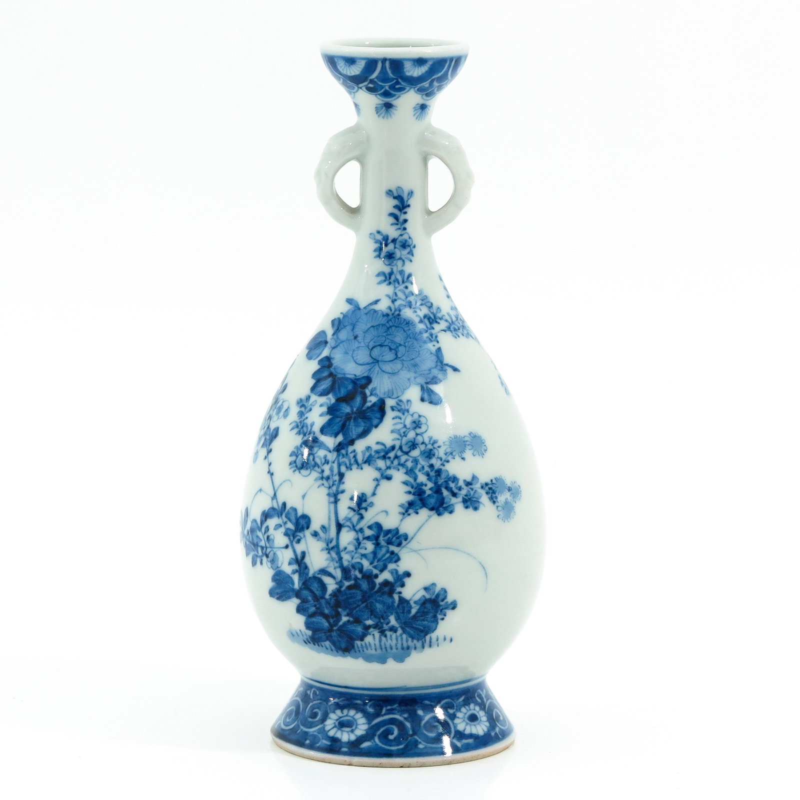 A Blue and White Vase: Floral decor, 19 cm. tall.