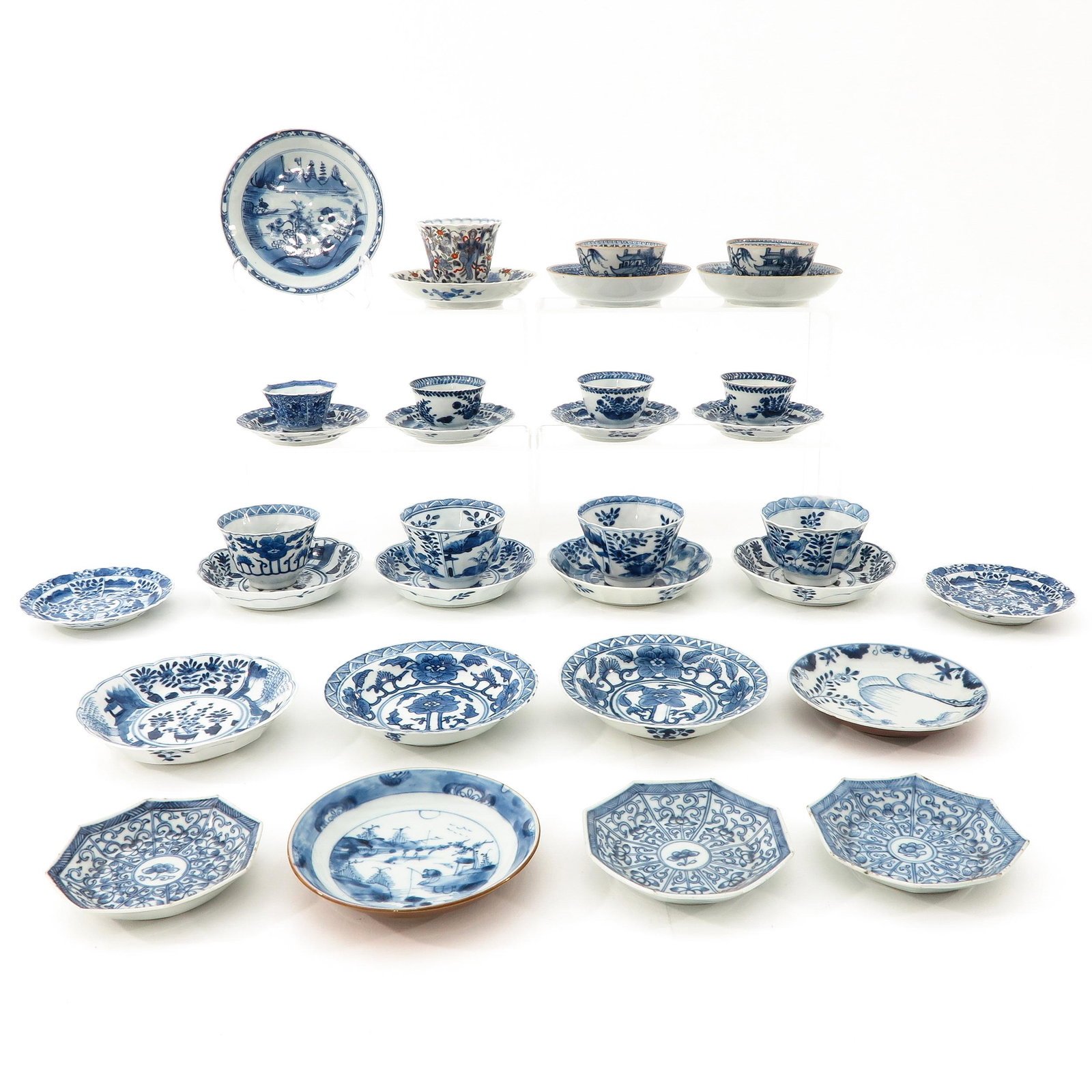 A Large Collection of Cups and Saucers: Including Kangxi Period, largest saucer is 14 cm. in diameter, chip and hairline.