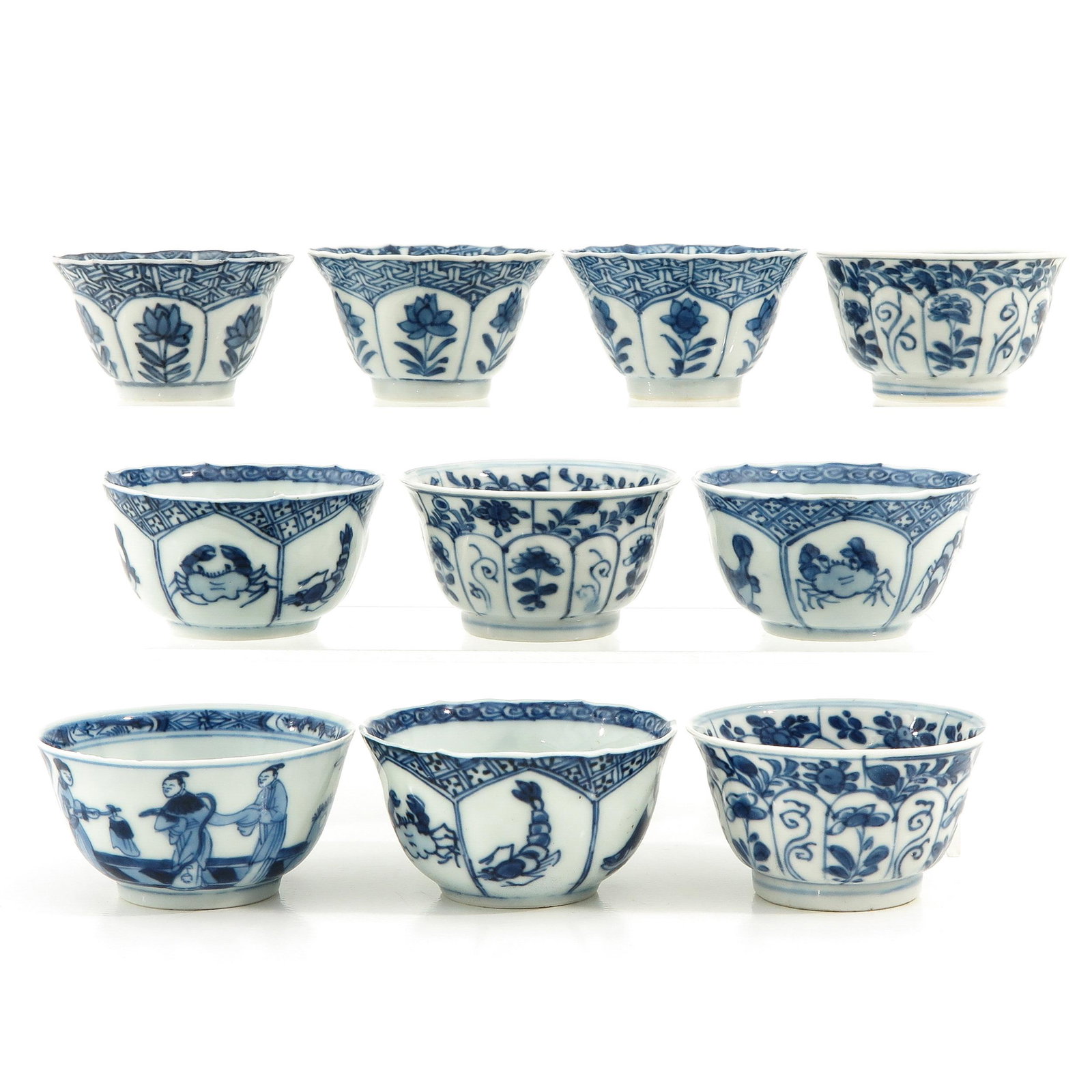 A Collection of 10 Cups: In diverse blue and white decors, 7 cm. in diameter, fritting and hairline.