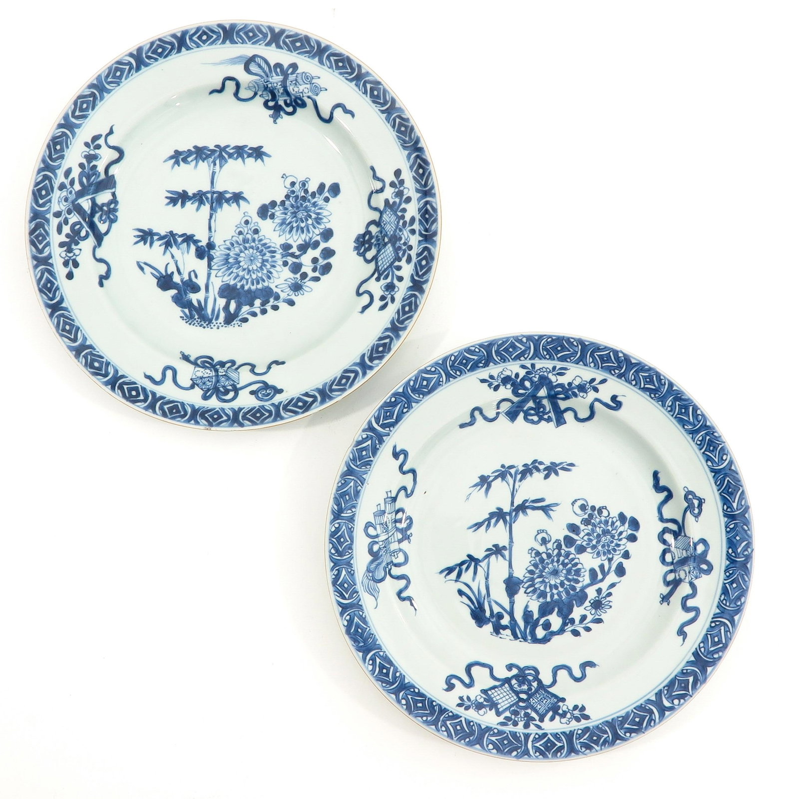 A Pair of Blue and White Plates: Floral decor, 28 cm. in diameter, fritting on edges.