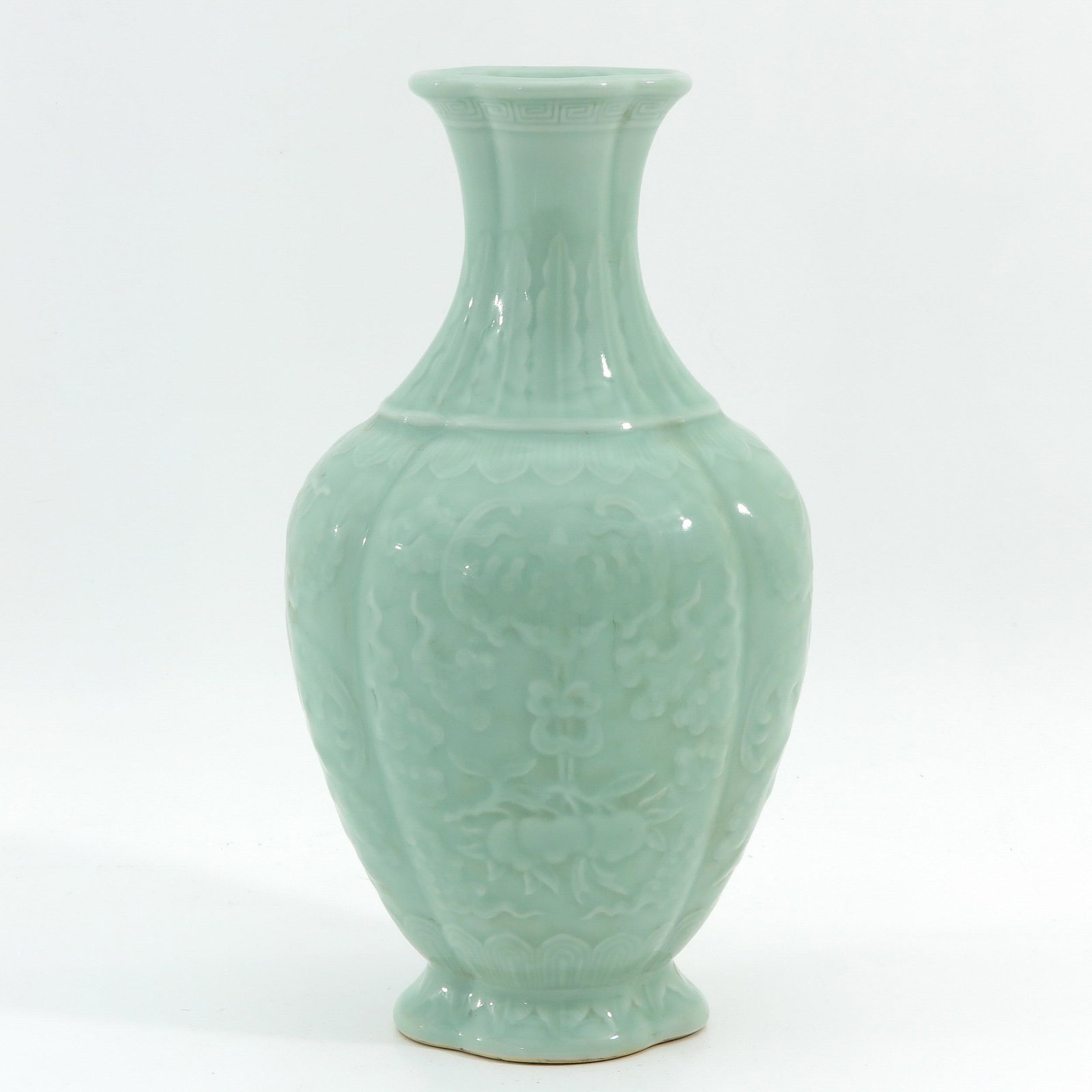 A Celadon Vase: Decorated with bats and peaches, Qianlong mark, 33 cm. tall.