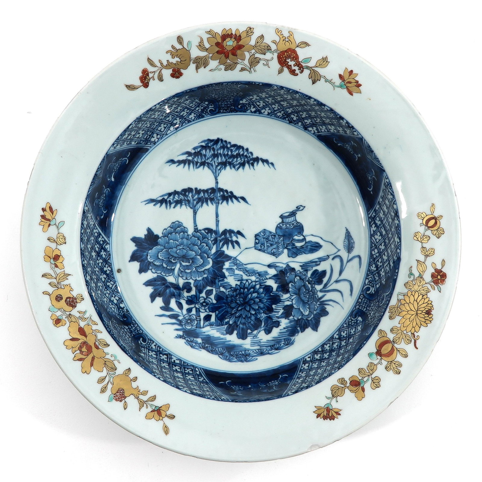 A Blue and Gilt Decor Basin: Depicting flowers, bamboo tree, and Chinese antiquities, 33 cm. in diameter, chip.