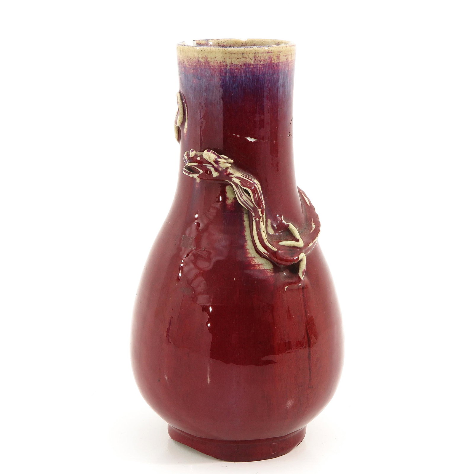 A Sang de Boeuf Vase: Decorated with dragons, 34 cm. tall, restored.