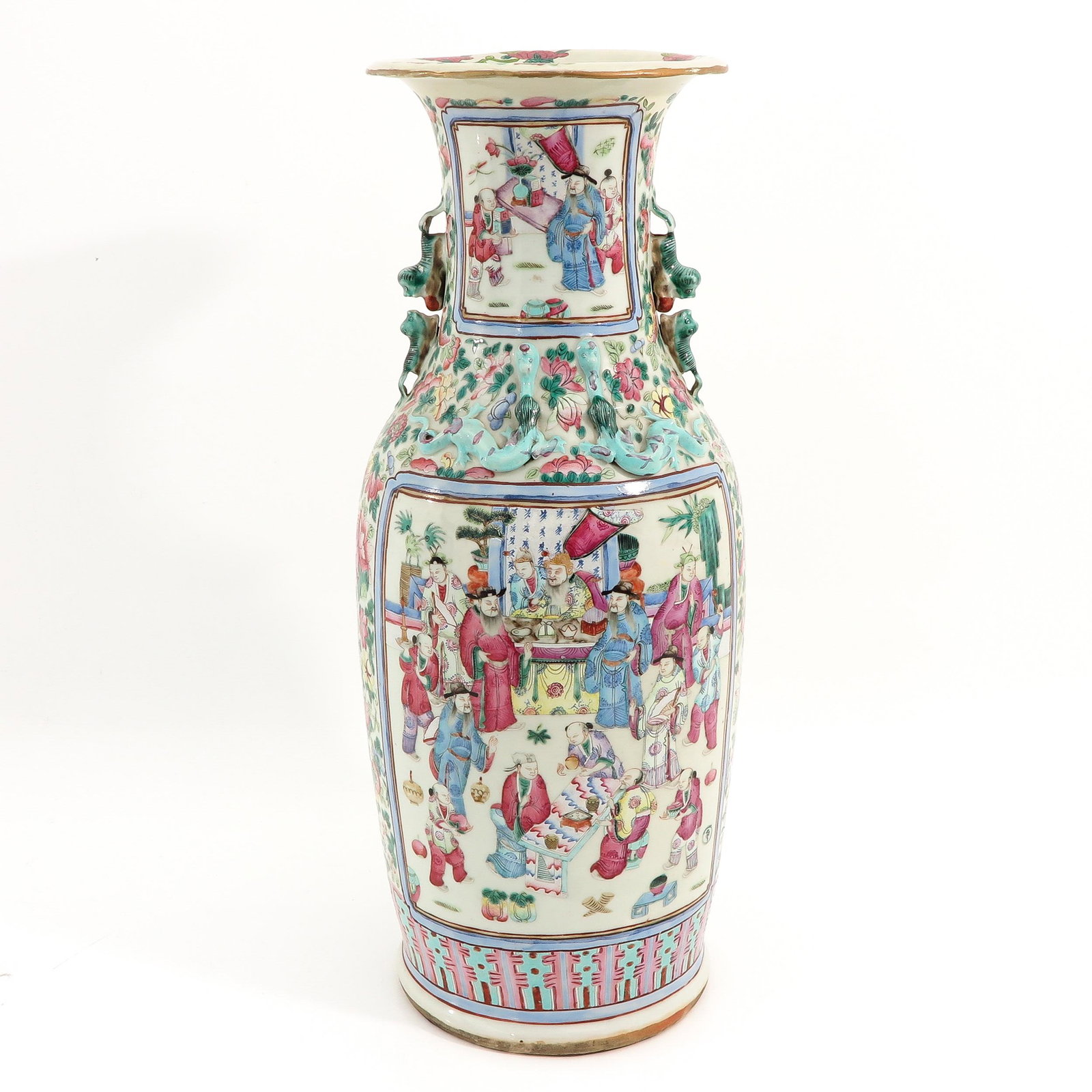A Famille Rose Cantonese Vase: Depicting Chinese figures with temple lion handles, 62 cm. tall, restored.