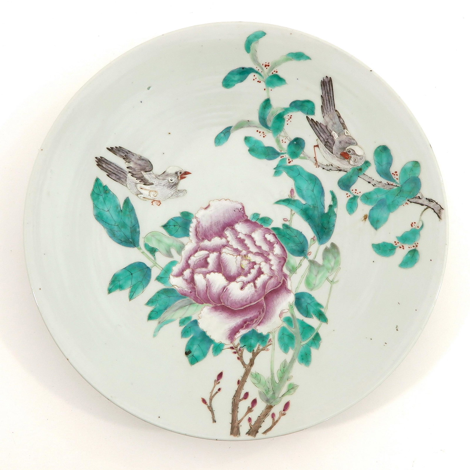 A Famille Rose Charger: Depicting flowers and birds, 35 cm. in diameter.