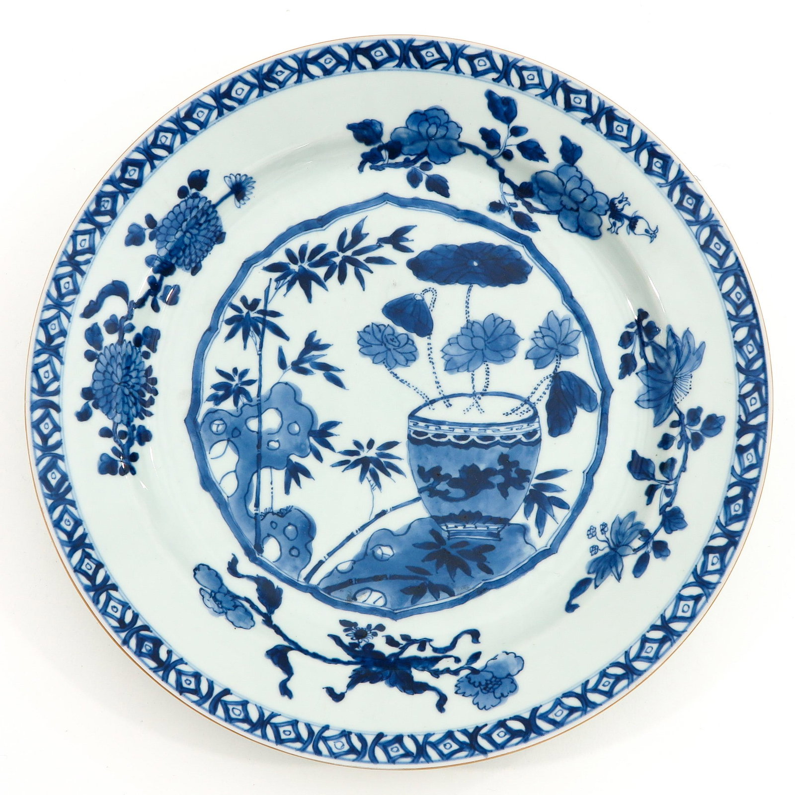 A Blue and White Charger: Depicting flowers in garden, 35 cm. in diameter.