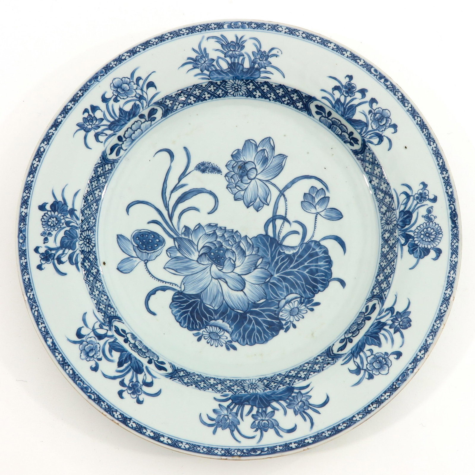 A Blue and White Charger: Floral decor, 18th Century, 39 cm. in diameter, chip.