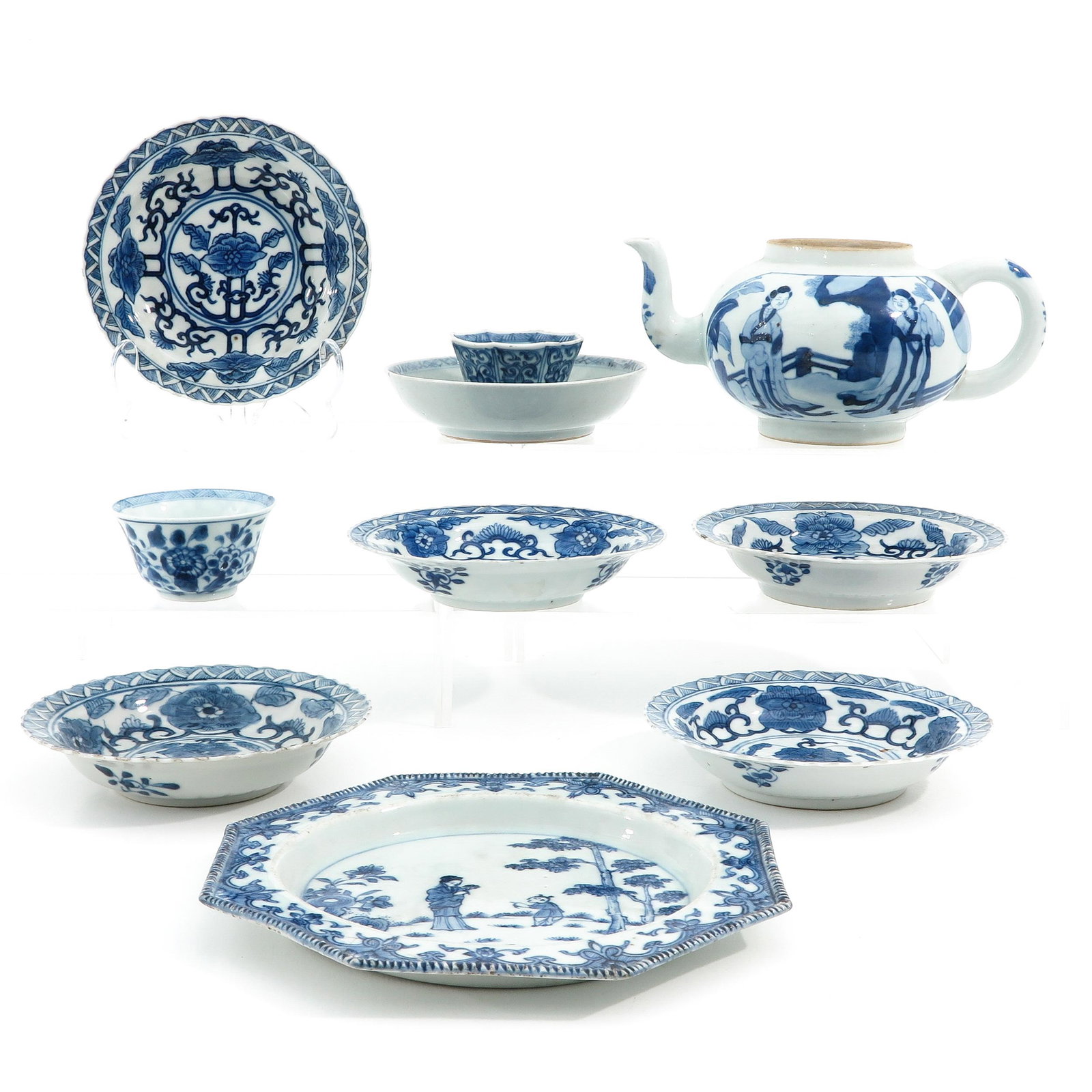 A Diverse Collection of Porcelain: Including teapot 7 small plates, and 2 cups, teapot is 9 cm. tall, in diverse conditions.