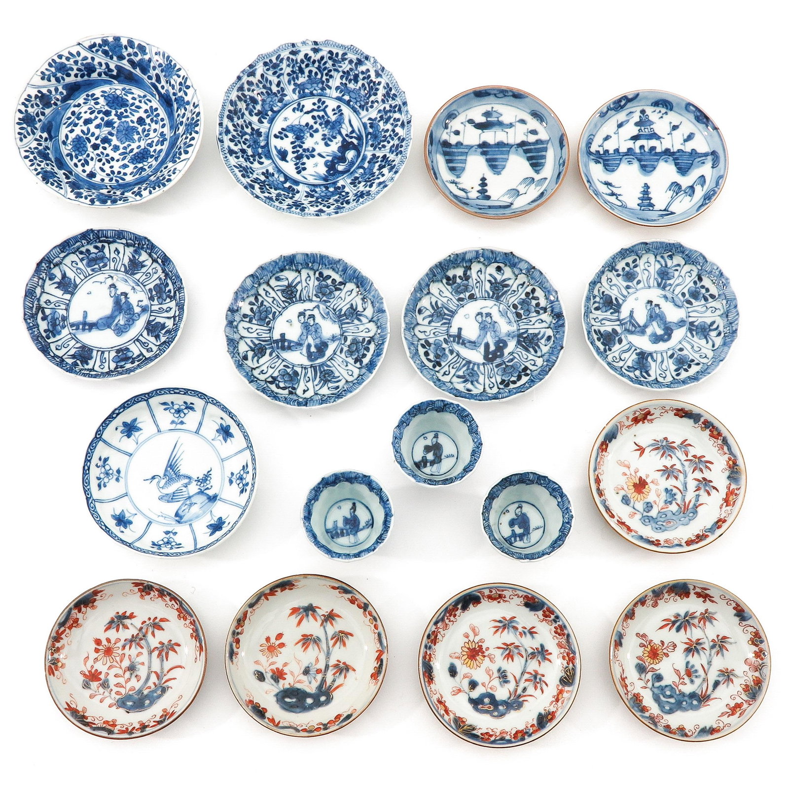 A Collection of Cups and Saucers: Including 3 cups and 14 saucers, saucers are 14 cm. in diameter, chip and hairline.
