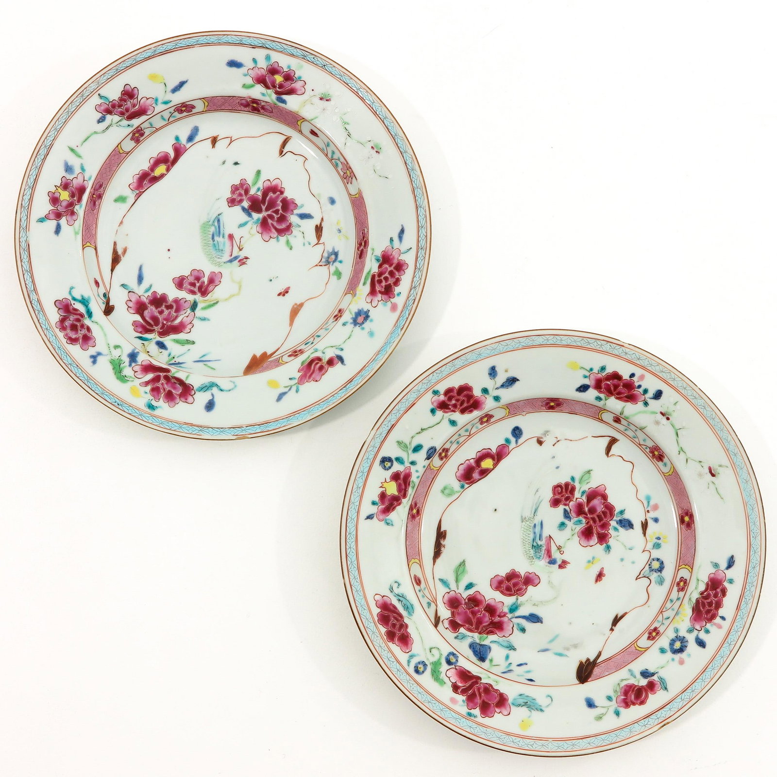 A Pair of Famille Rose Plates: Floral decor, 18th Century, 24 cm. in diameter, chip.