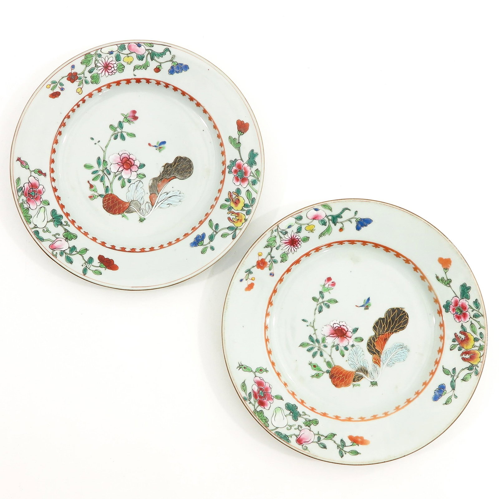 A Pair of Tobacco Decor Plates: In Famille Rose enamels, 23 cm. in diameter.
