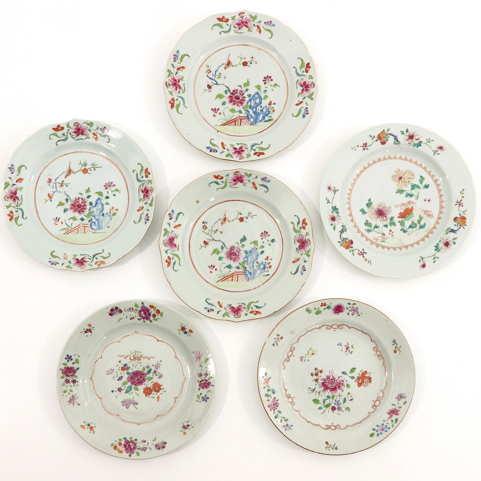 A Set of 6 Famille Rose Plates: 23 cm. in diameter, chip.