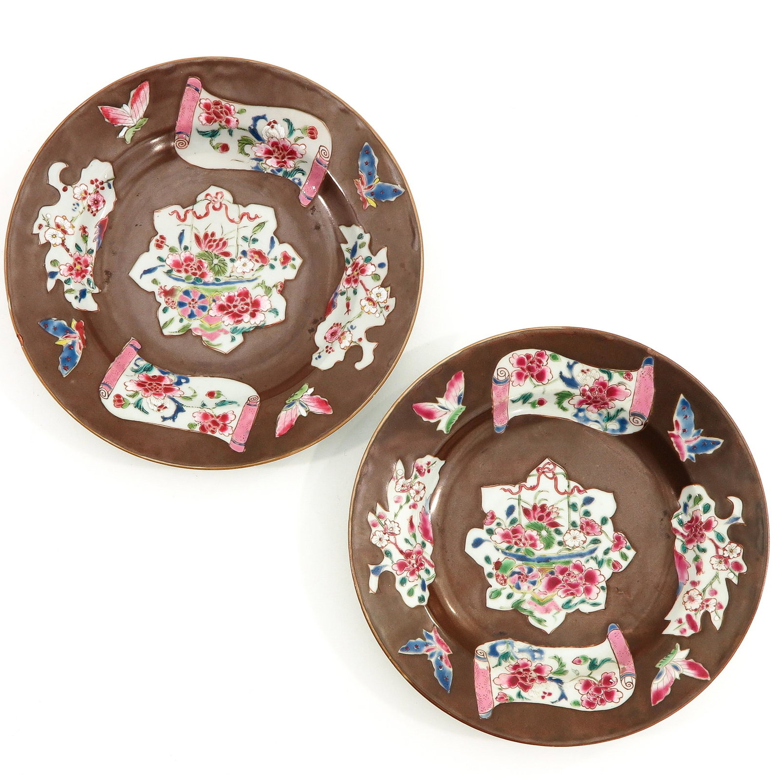 A Pair of Famille Rose Plates: Batavianware, 18th Century, 23 cm. in diameter, chip.