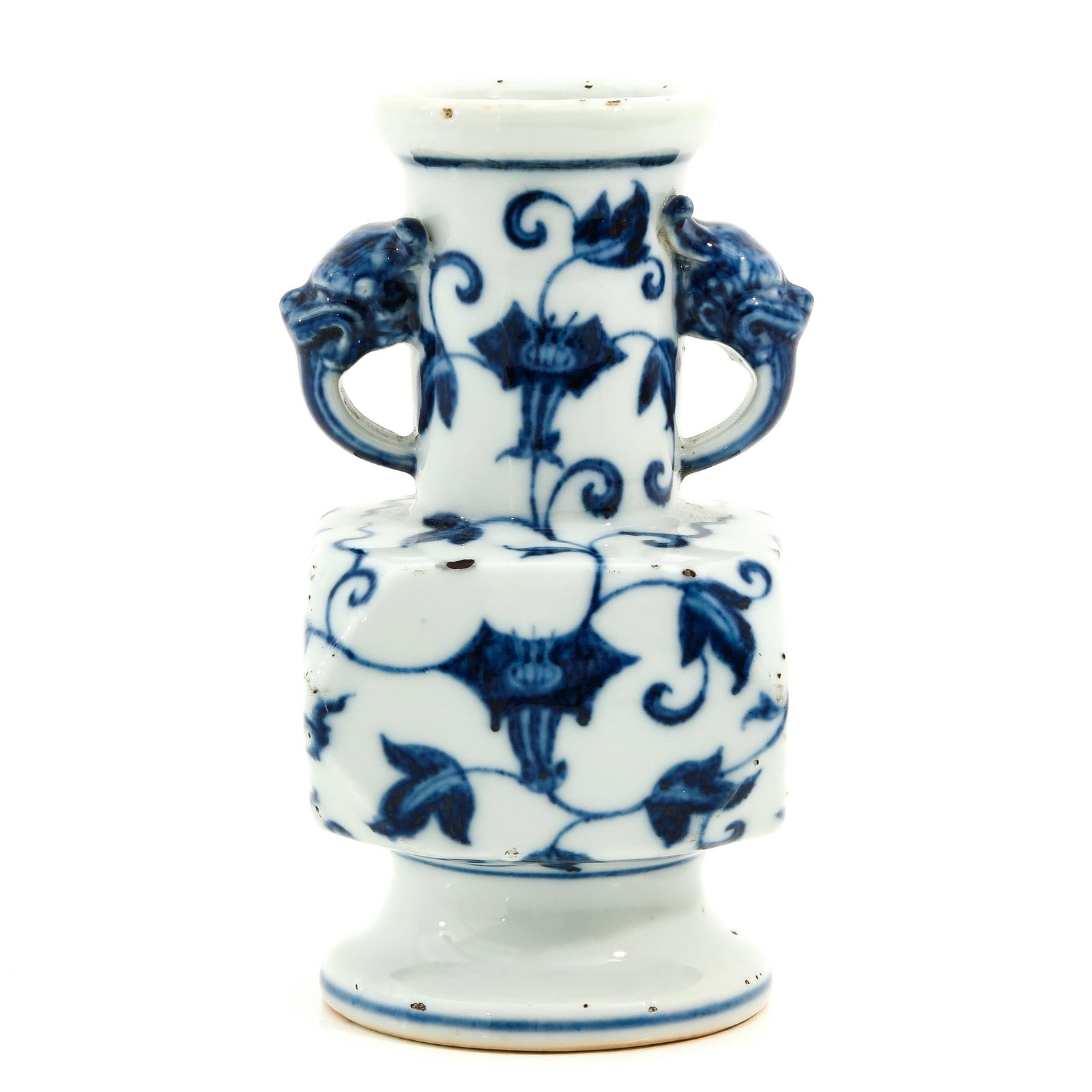 A Blue and White Vase: Floral decor, dragon head handles, Xuande mark, 16 cm. tall, fritting.