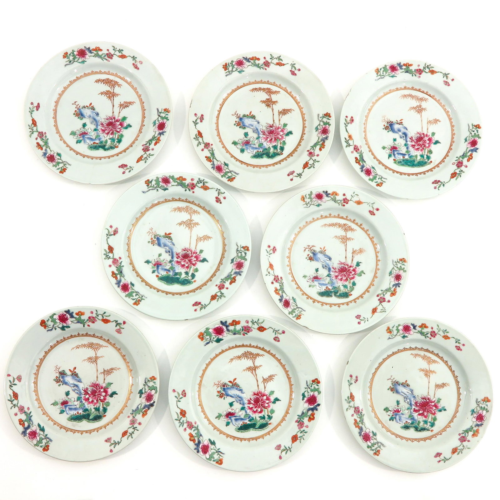 A Series of 8 Famille Rose Plates: Depicting scene in garden, 23 cm. in diameter, chip and hairline.