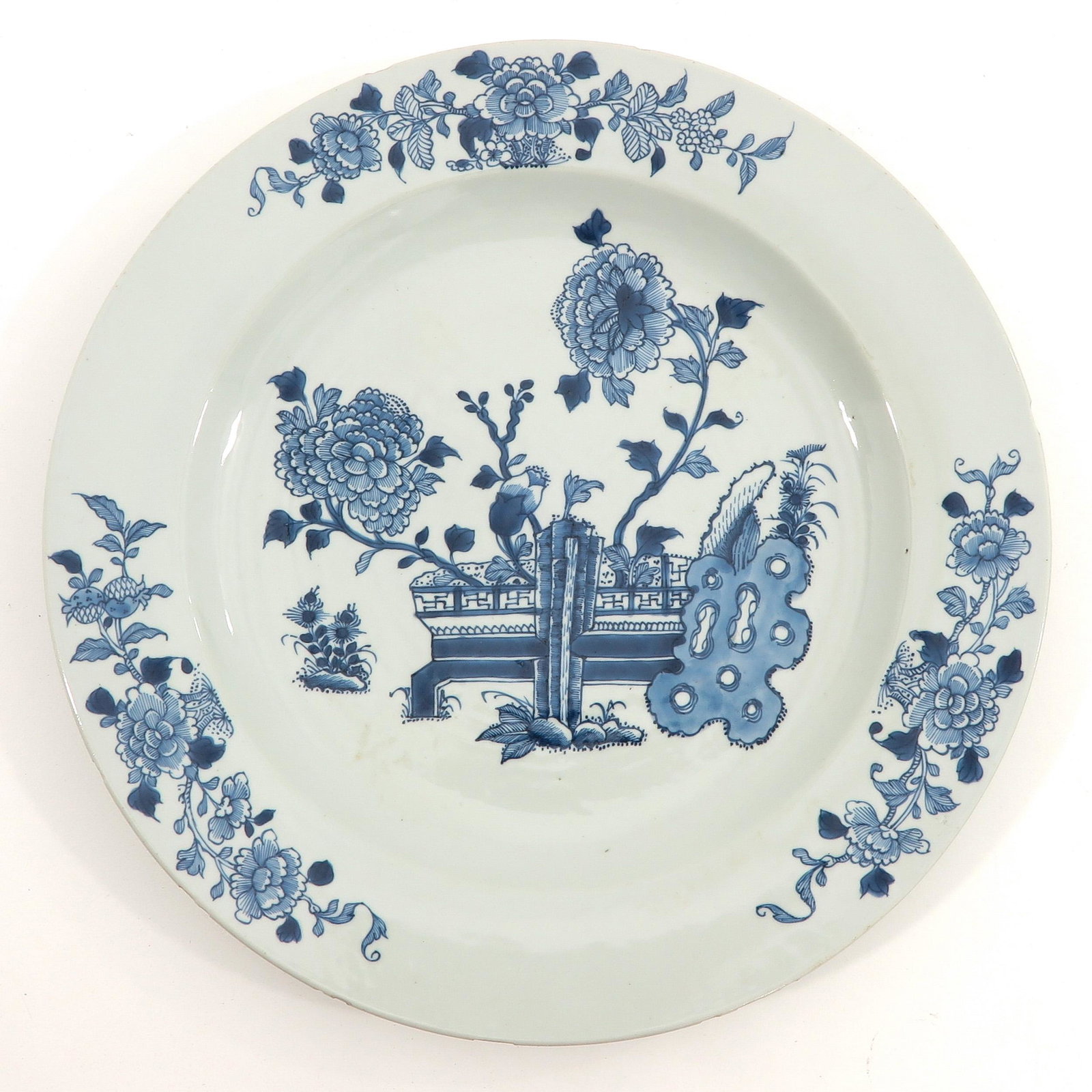 A Blue and White Charger: Floral decor, 39 cm. in diameter, chip.