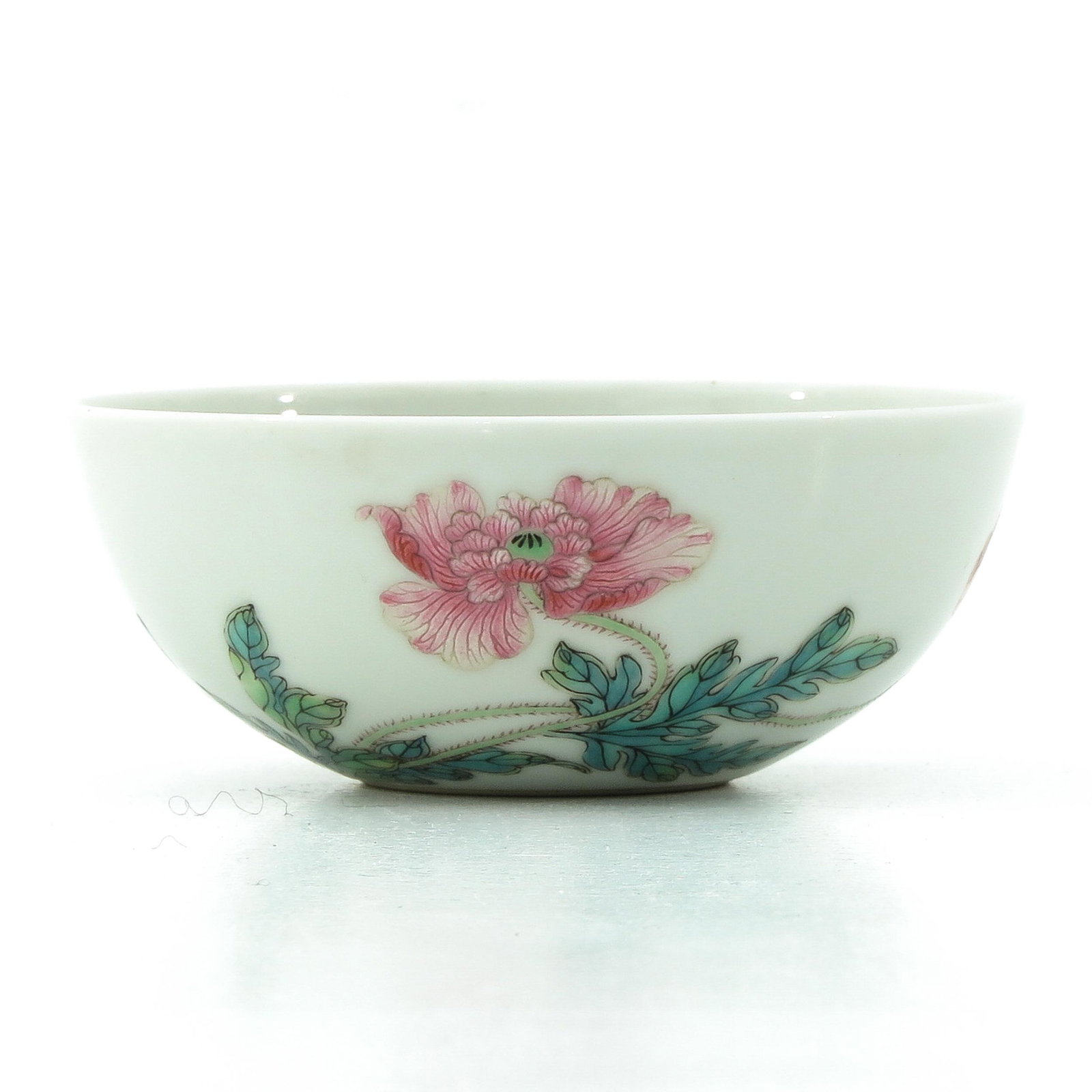 A Famille Rose Cup: Floral decor, Yongzheng mark, 10 cm. in diameter.