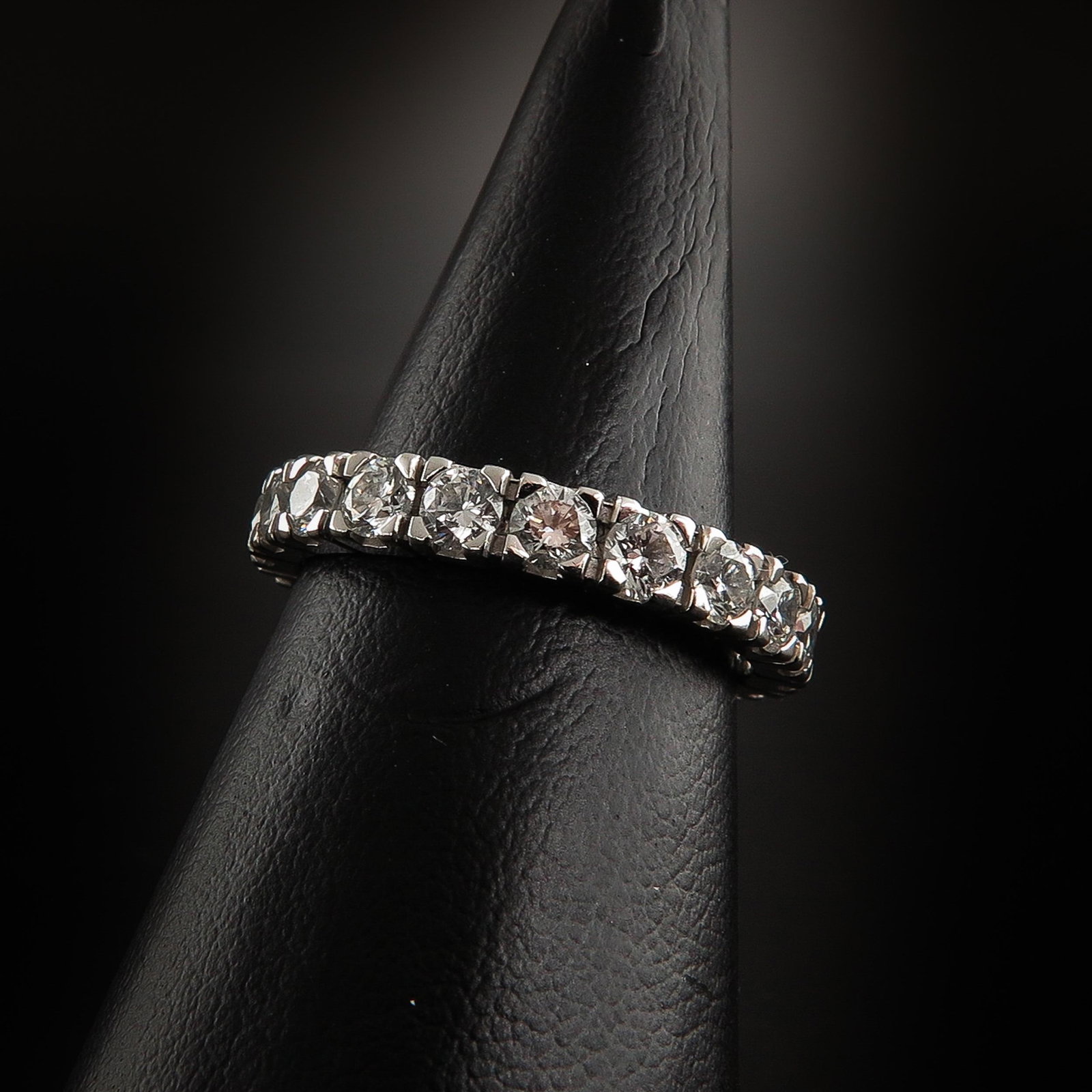 A Ladies 14KG Diamond Eternity Band: Set with 20 brilliant cut diamonds, ring size 17.