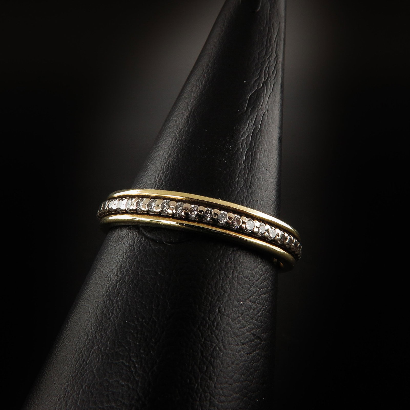 A Ladies 14KG Diamond Eternity Band: Set with brilliant cut diamonds, ring size 19.
