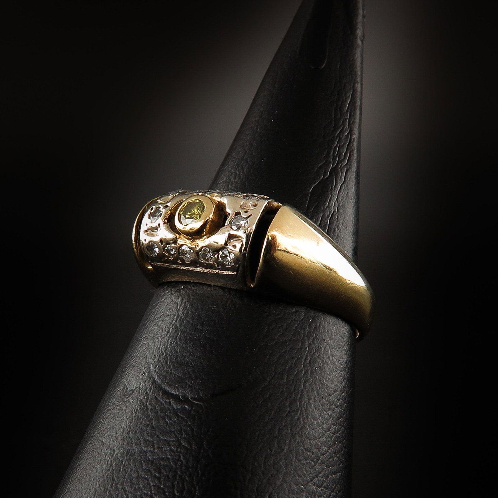A Ladies Diamond Ring: Set with 13 diamonds, including 1 yellow diamond, ring size 15.5.