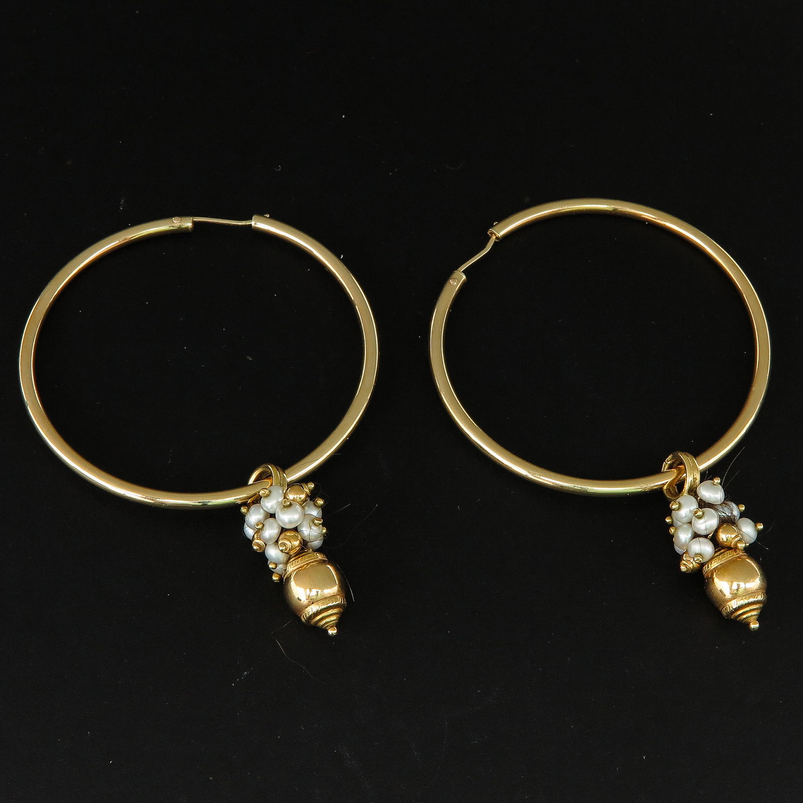 A Pair of 14KG Seed Pearl Earrings: 60 mm. in diameter.
