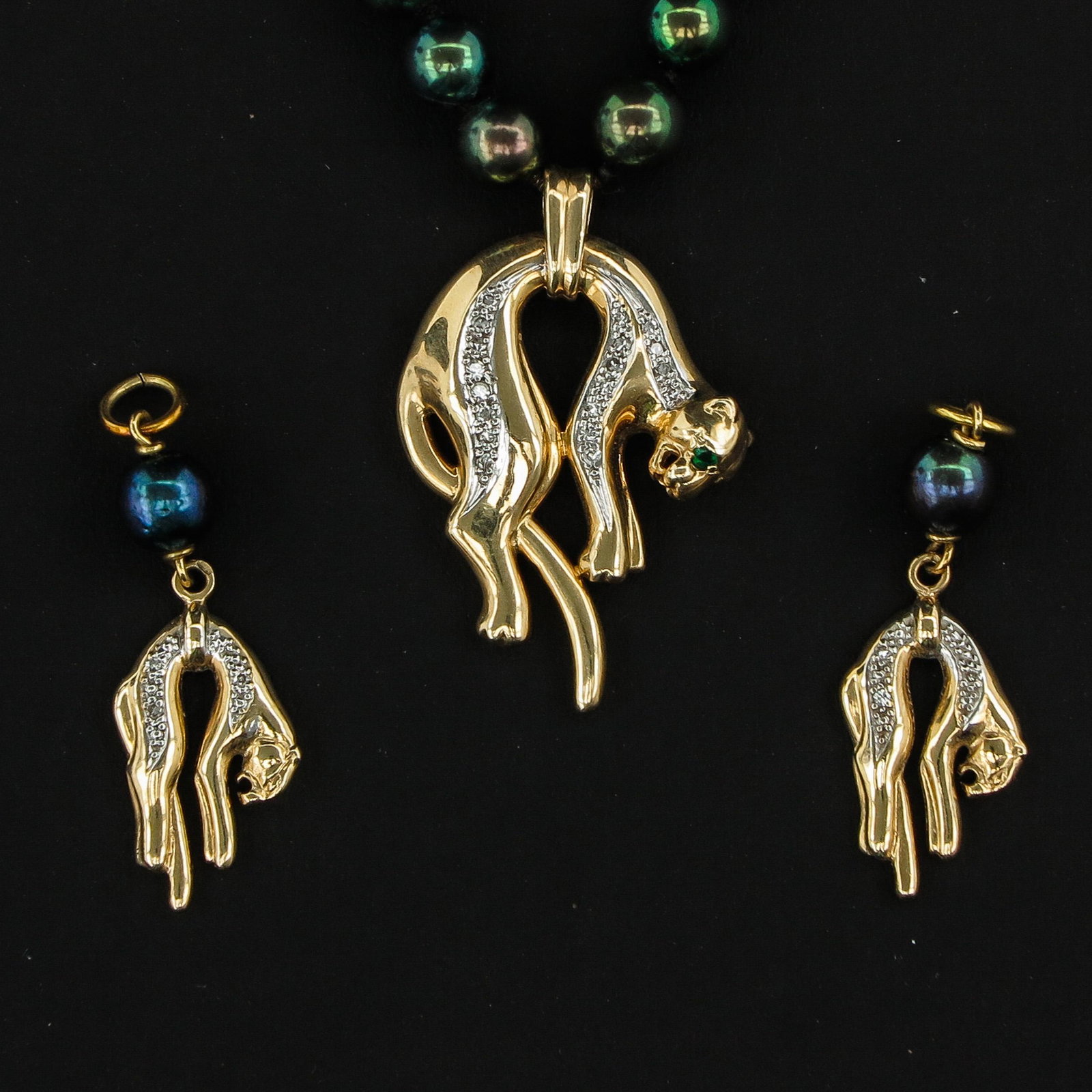 A Collection of Jewelry: Necklace is 50 cm. long, marked Kobu, also including 14KG pendant in the form of a panther set with diamonds and emerald, in addition to 2 pendants in the form of a panther.