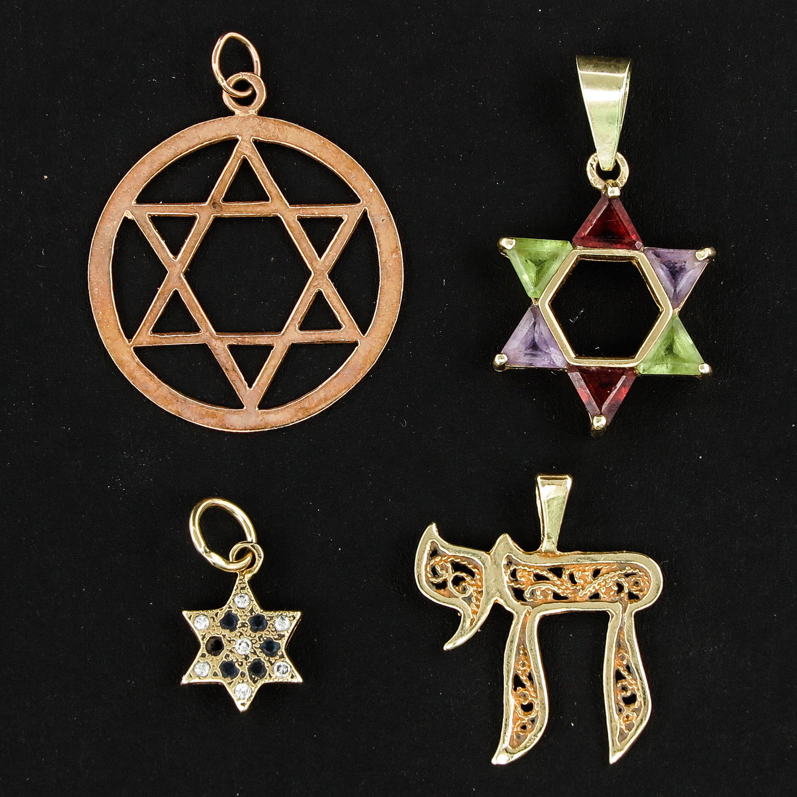 A Collection of Pendants: Including 14KG Star of David 26 mm. in diameter.