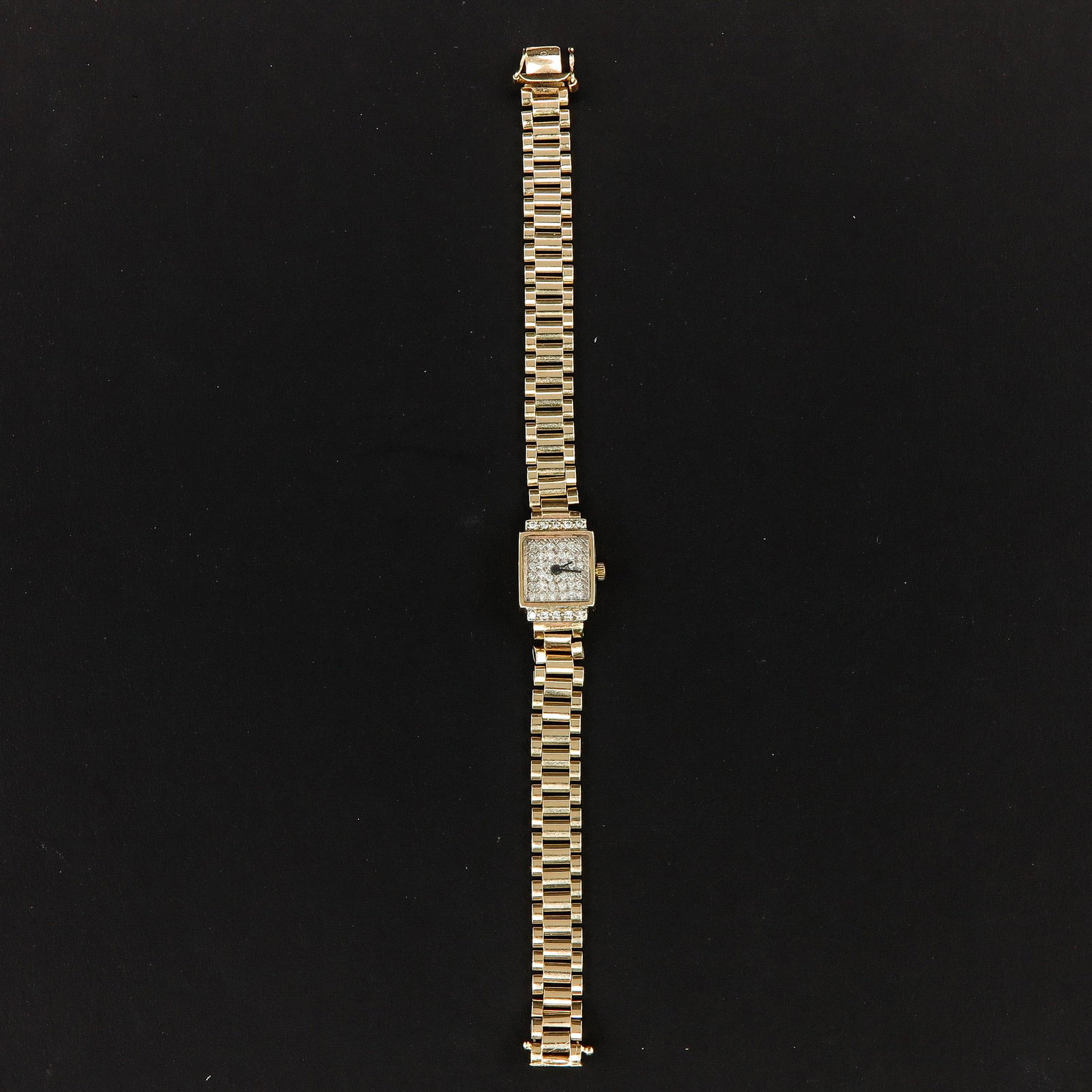 A Ladies 14KG Watch: 14 cm. long, set with diamonds.