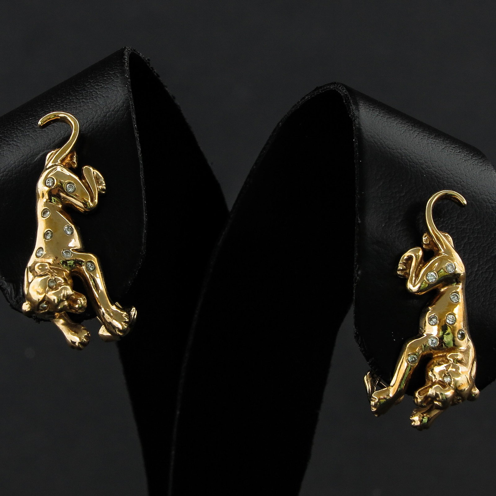 A Pair of Panther Diamond Earrings: 31 mm. long, set with 20 diamonds.