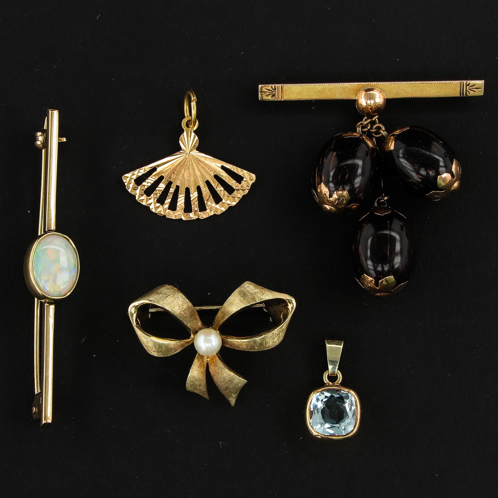 A Lot of 5 Pendants and Brooches: Including Opal brooch 51 mm. long.