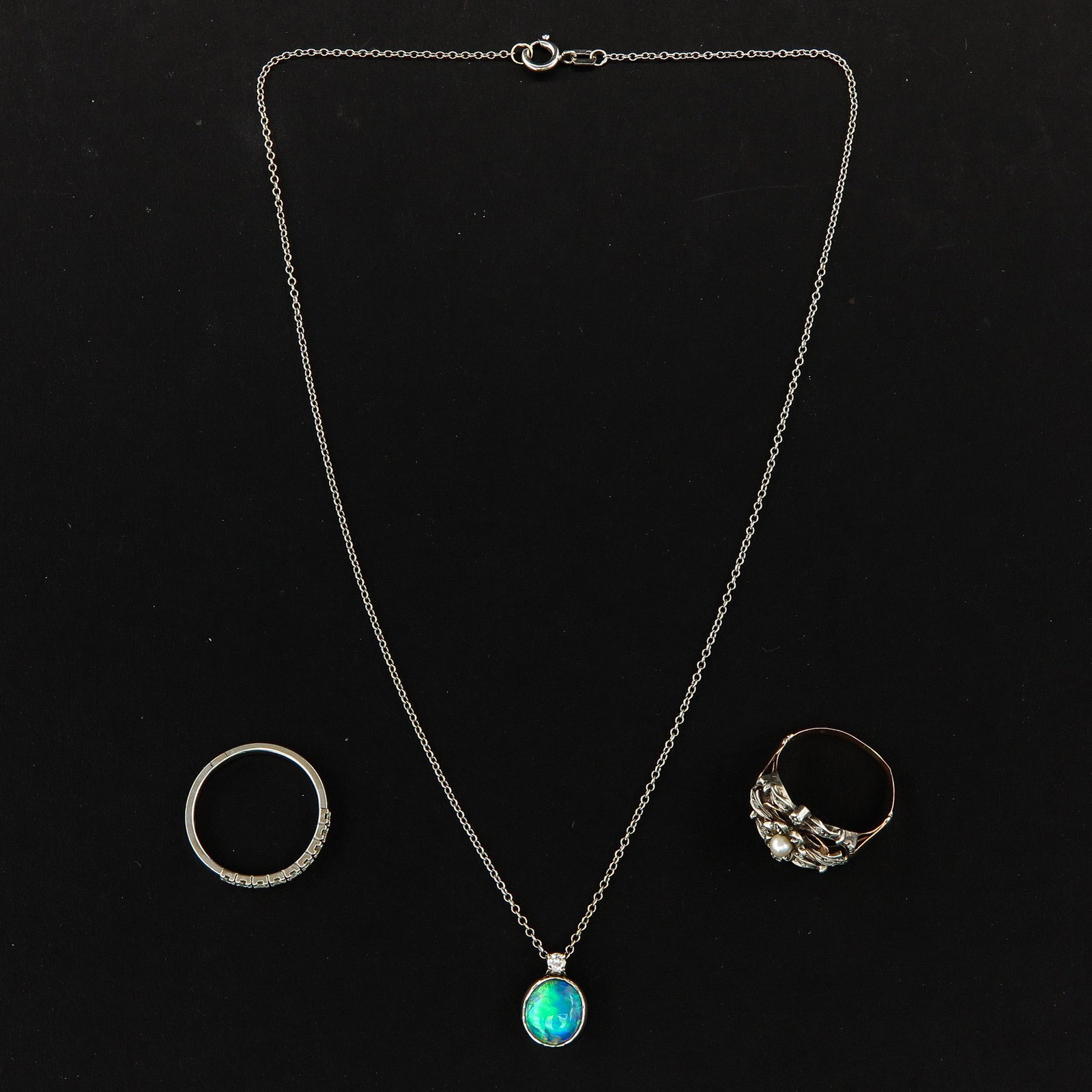 A Collection of Jewelry: 2 rings in half eternity band, 18KG ring size 18 and 14KG necklace with diamond and opal pendant.