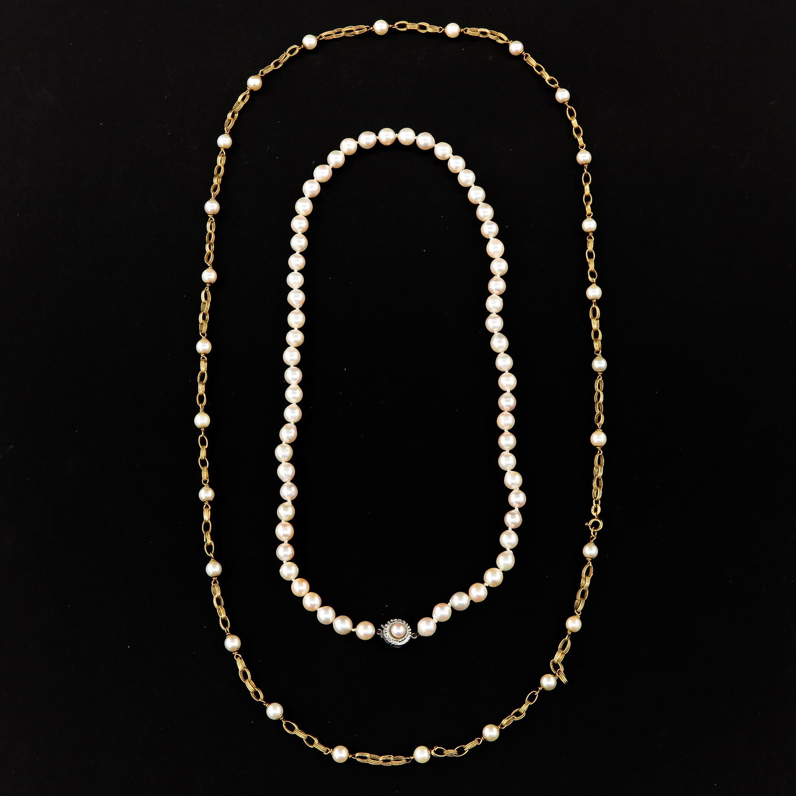 A Lot of 2 Pearl Necklaces: Pearls are 6 - 7 mm. in diameter, 1 with 14KG clasp and the other with 18KG links.