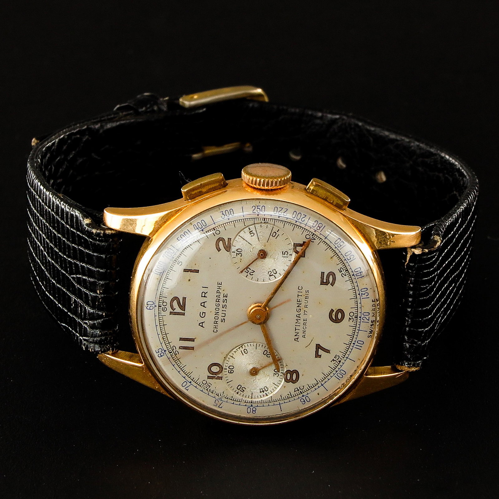 A Mens 18KG Agari Chronograph Suisse Watch: On leather band, case is 33 mm. in diameter.