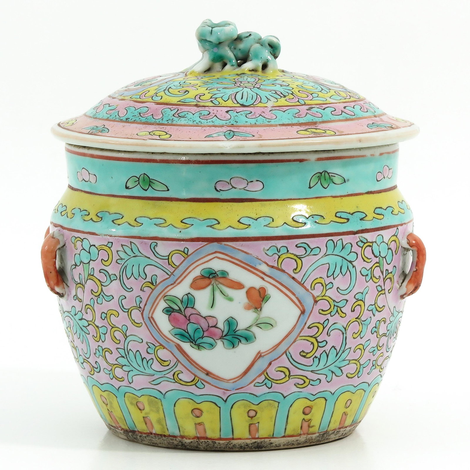 A Famille Rose Jar with Cover: Floral decor with temple lion on cover, 16 cm. tall, chip.