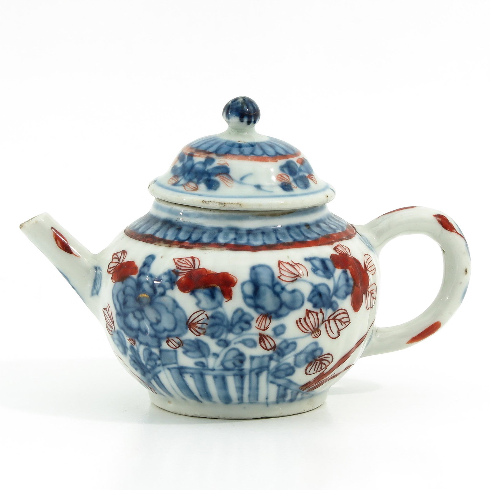 An Imari Decor Teapot: Floral decor, 10 cm. tall.