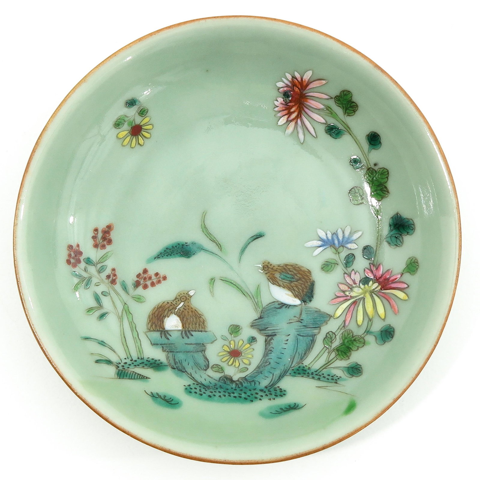 A Celadon Dish: Decorated with flowers and birds, 15 cm. in diameter.
