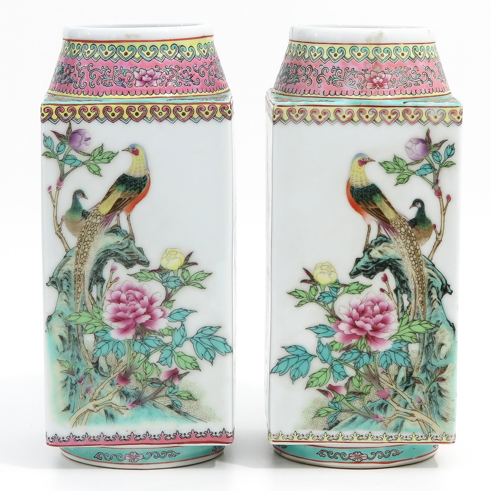 A Pair of Square Vases: Decorated with flowers in Famille Rose enamels, 27 cm. tall.