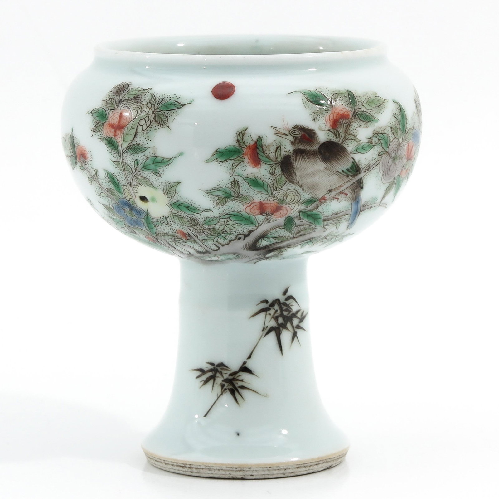 A Famille Verte Stem Cup: Decorated with birds in trees, 15 cm. tall.